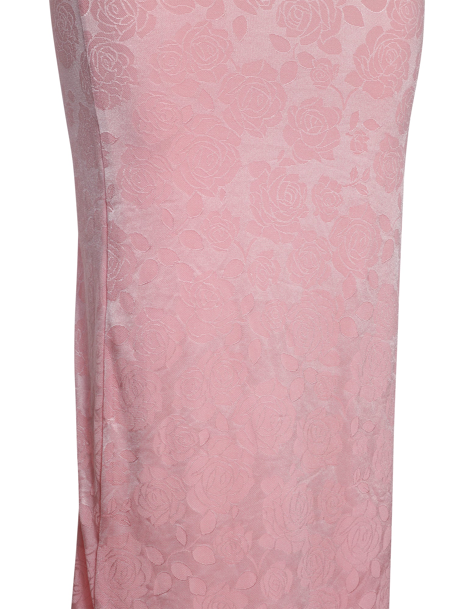 Close-up of the ERICKA DRESS - PINK by TIGERMIST, showcasing a subtle floral pattern. The fabric boasts an embossed rose design, adding a textured and elegant aesthetic. The image zooms in on the lower part of the dress, emphasizing the intricate details of the pattern.