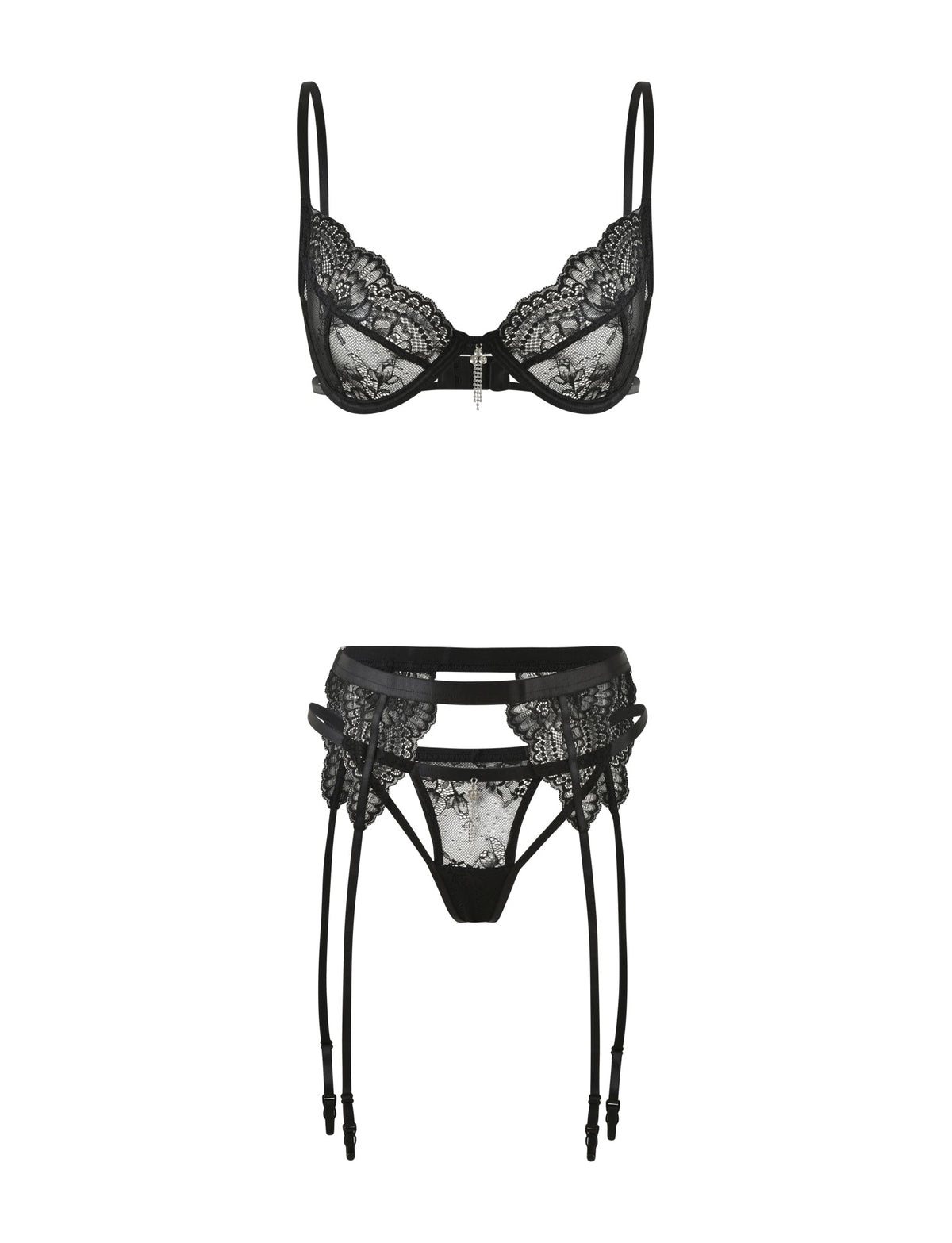 The JORDAN SET - BLACK by TIGERMIST showcases an elegant black lace intimate set with a delicate underwire bra with thin straps, paired with a matching garter belt featuring suspenders. Both pieces are adorned with intricate lace detailing and a central decorative element.