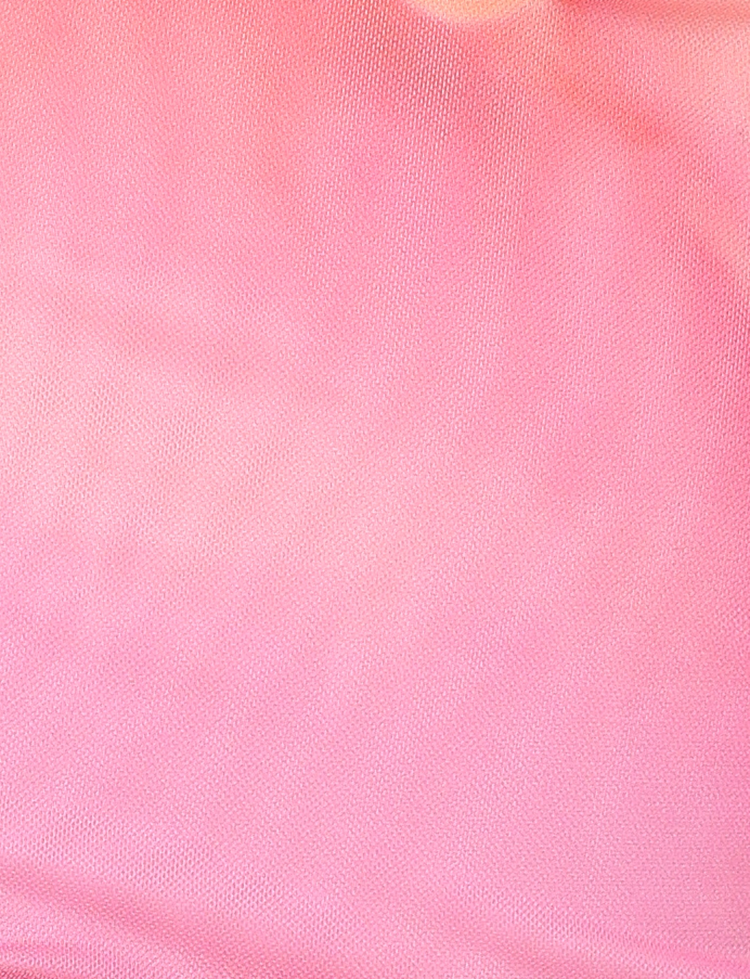 Close-up of the CHER MINI DRESS - PINK HIBISCUS by TIGERMIST, showing its pink macro floral textured fabric with a subtle mesh-like pattern and a slight color gradient—ideal for a strapless bandeau or bodycon mini dress style.