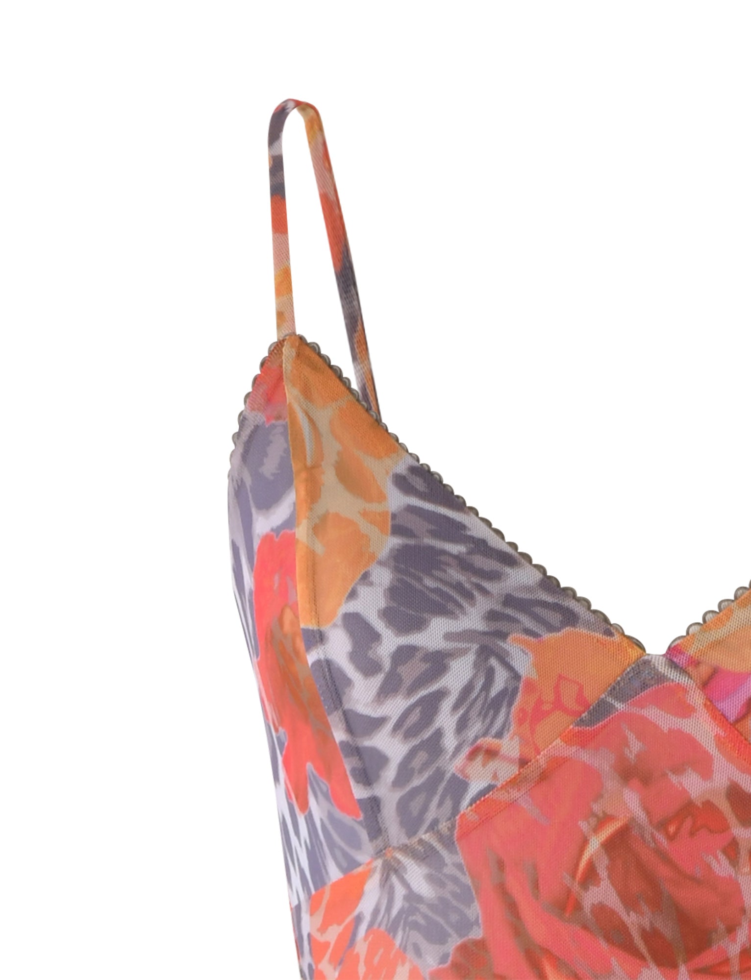 Close-up of the JULIANNA DRESS from TIGERMIST with thin straps. This colorful garment showcases a vibrant floral pattern in shades of orange, pink, purple, and gray, and features a scalloped neckline that adds a delicate detail.