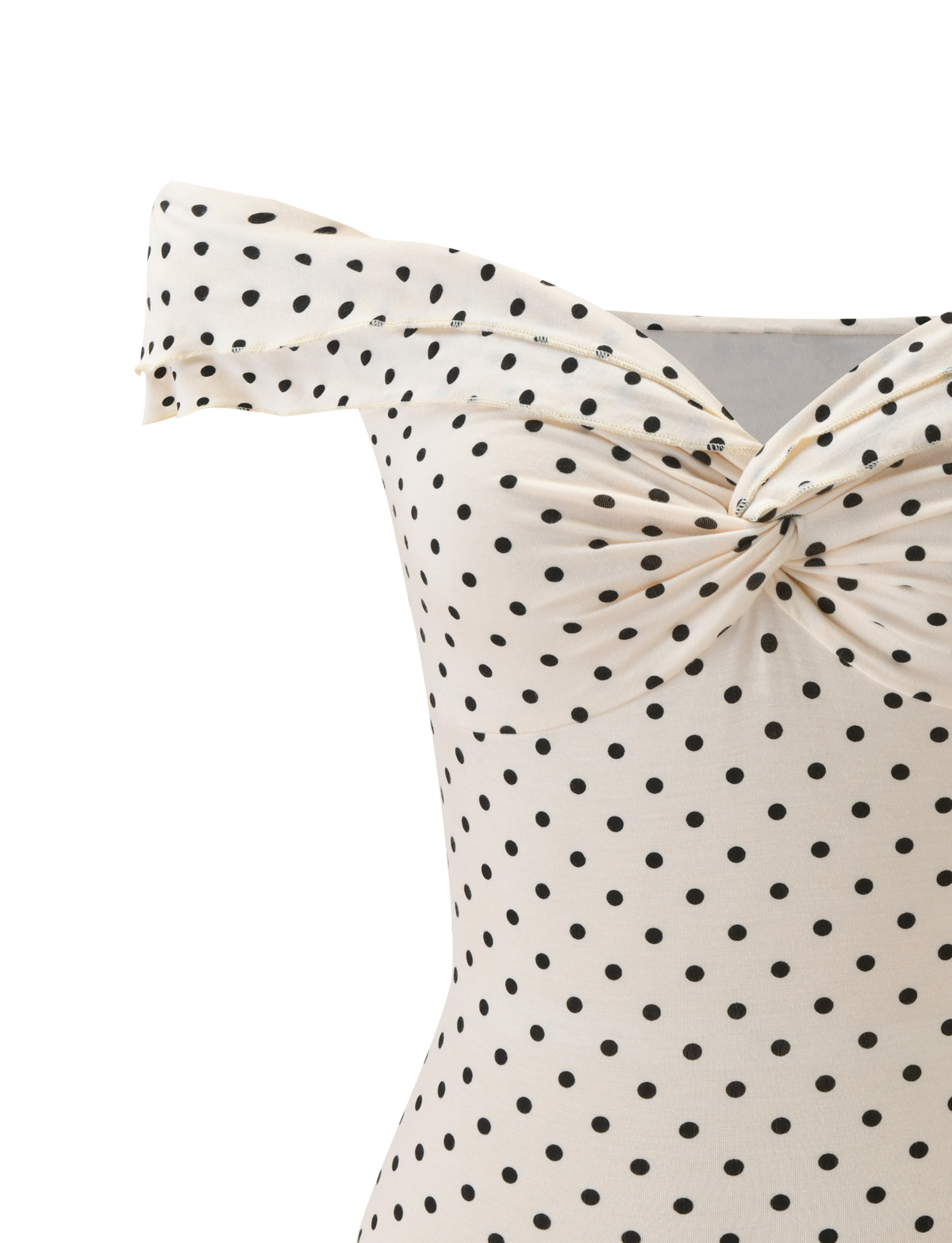 A close-up of the TIGERMIST DENALI TOP - CREAM DOT, an off-shoulder cream top with black polka dots and a twisted knot at the neckline.