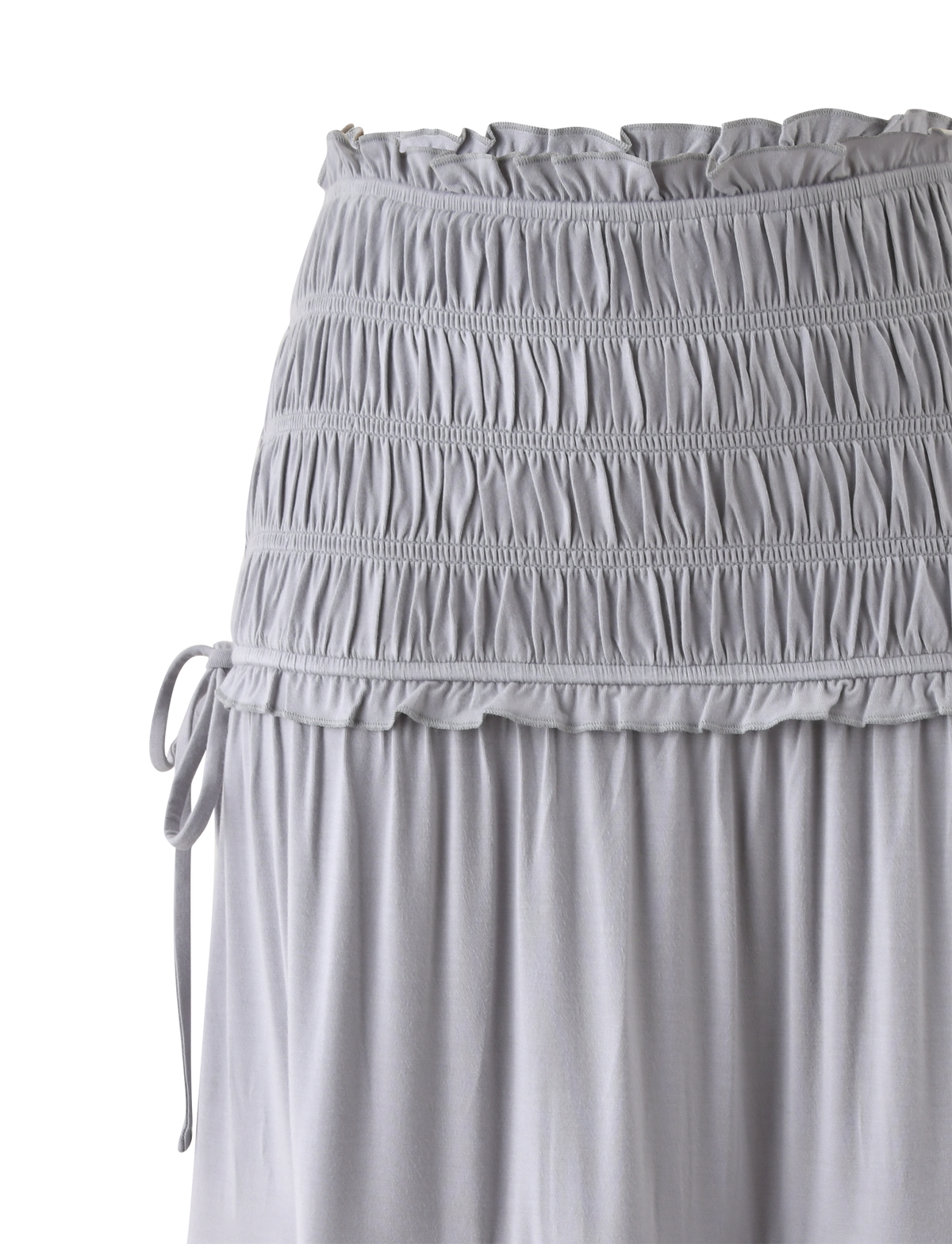The DENALI MAXI SKIRT in Dove Grey by TIGERMIST features soft modal fabric, a shirred waistband with ruched stitching, side drawstring ties, and a lightweight, flowing fit for easy style.