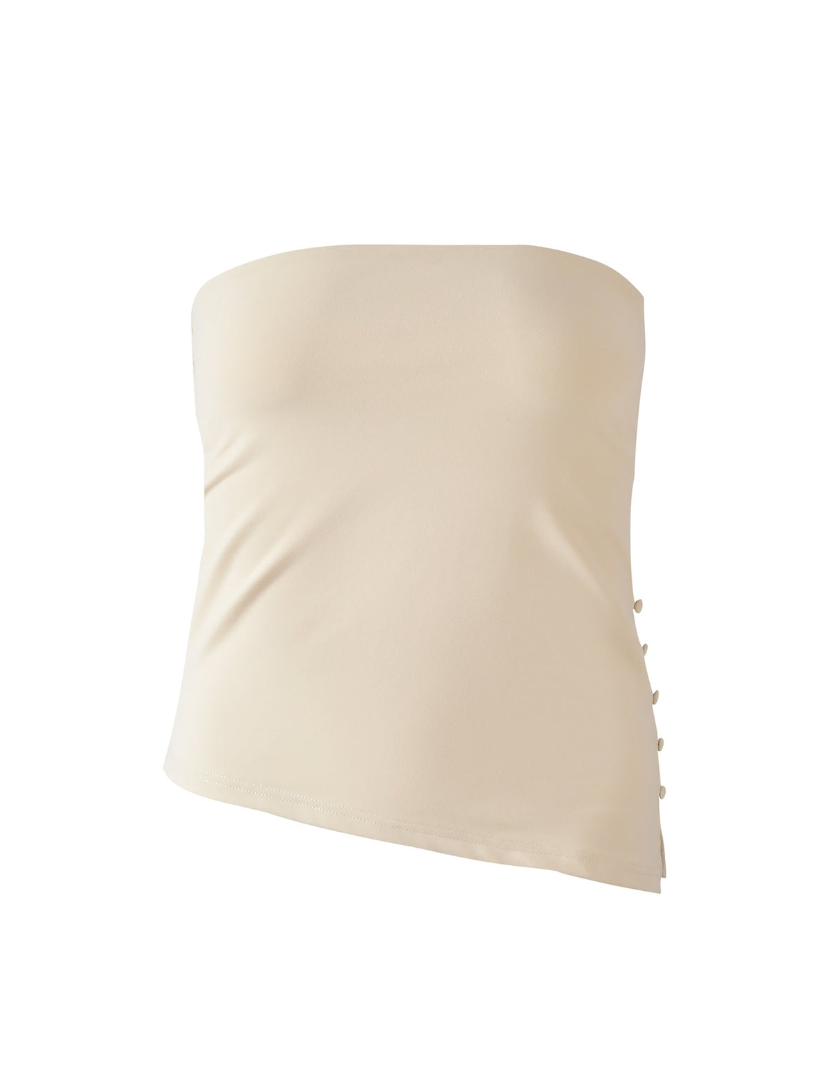 The INDIRA TOP - CREAM by TIGERMIST is a beige strapless top with a fitted silhouette, side decorative buttons, and an elegant asymmetrical hem.