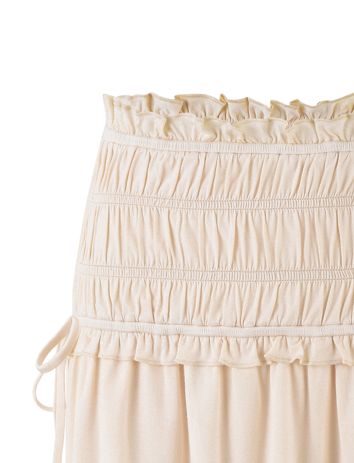 Close-up of the waistband and upper section of the TIGERMIST DENALI MINI SKIRT - WHITE : BONE, showcasing gathered ruched buttery jersey, ruffle trim, a mid-rise waist, and left-side drawstring detail.