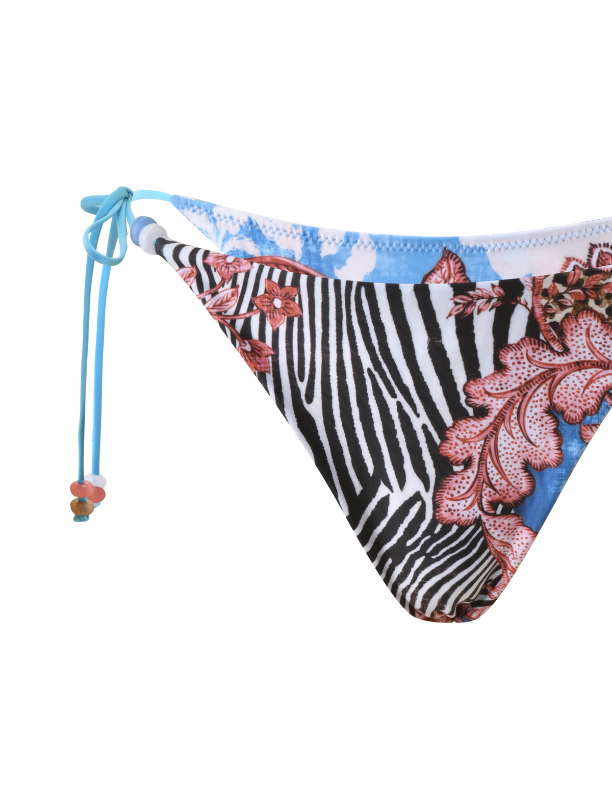 Close-up of the FINLEA BIKINI BOTTOM - GLOBAL ANIMAL HAZE by TIGERMIST, featuring a black and white animal print with red and pink coral-inspired florals, blue accents, and blue side ties finished with colorful beaded details.