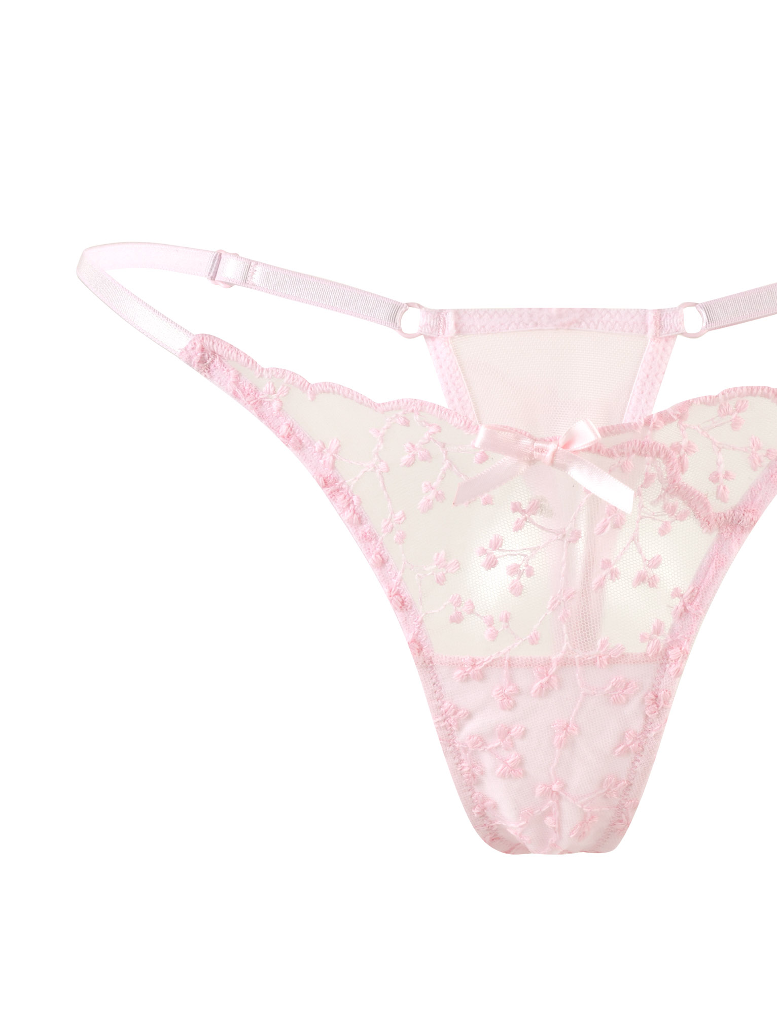 The TALIYAH SET - PINK by TIGERMIST features a sheer baby pink lace thong with floral embroidery, thin side straps, and a small front bow, shown against a white background.
