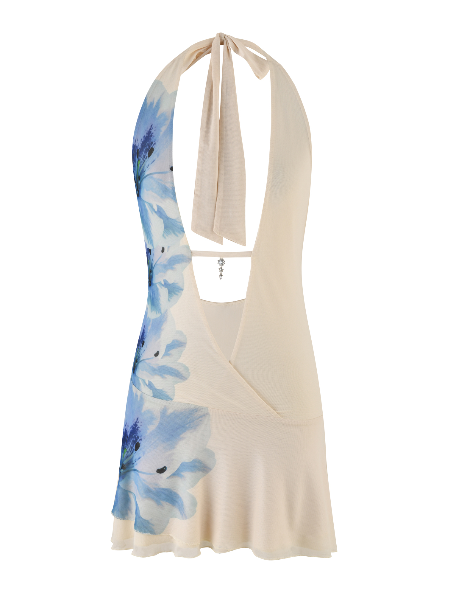 The BROOKS DRESS by TIGERMIST is a cream, sleeveless halter dress with a blue floral print, open back with neck tie, wrap-style front, plunging neckline, and subtle ruffled hem.
