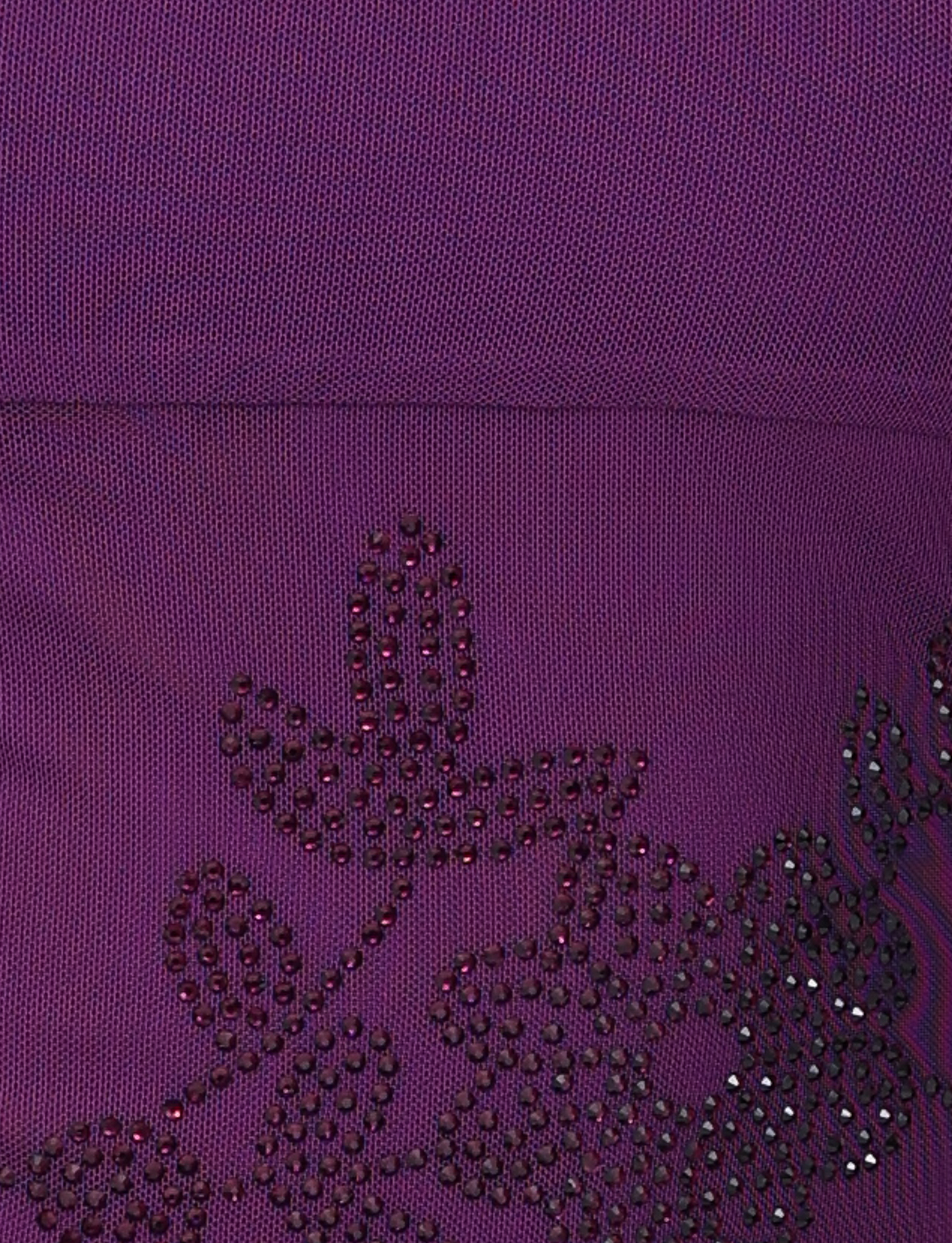 Close-up of textured purple fabric on the TIGERMIST OCTAVIA TOP, featuring intricate floral embellishments made from small black beads and studs that form delicate flowers and leaves.