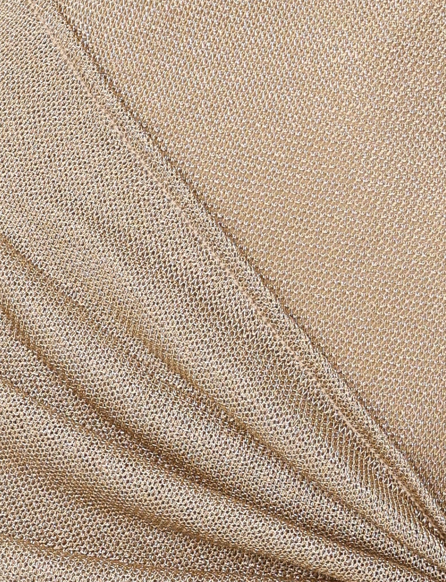 Close-up of gold metallic knit fabric with a shimmering, mesh-like texture—perfectly draped for the luxurious AZELMA MAXI DRESS - GOLD by TIGERMIST or any elegant maxi style.