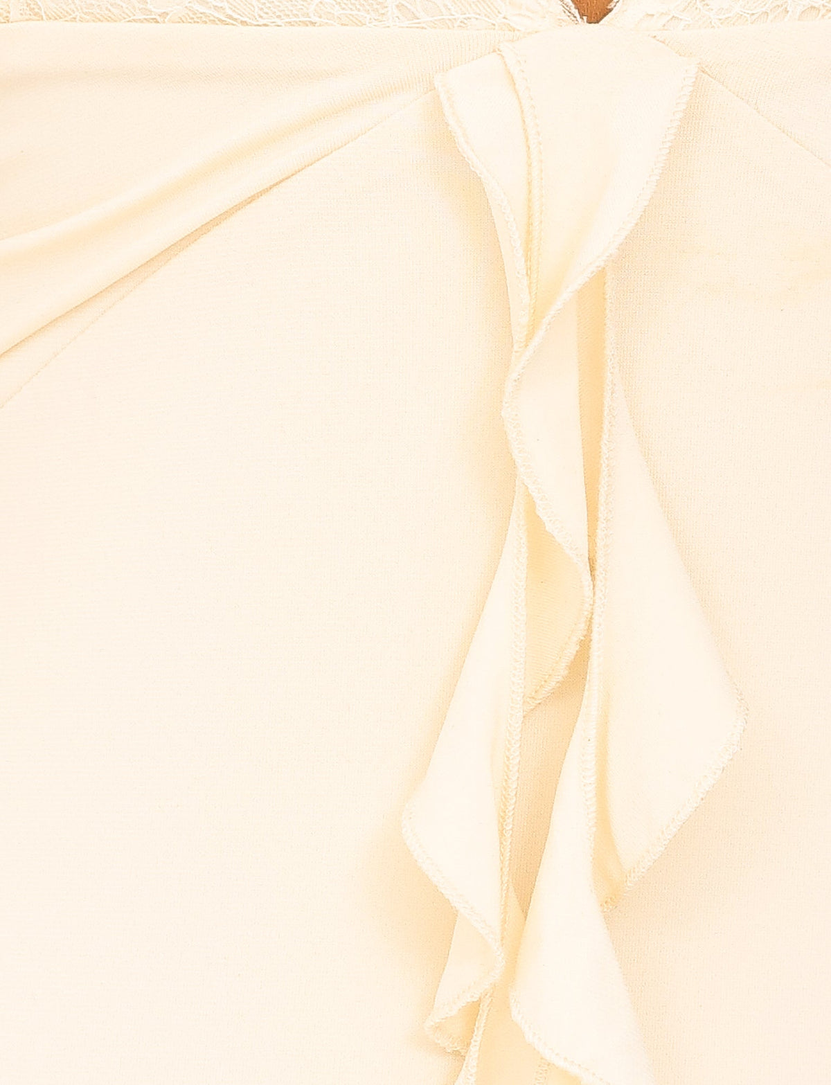 Close-up of a yellow fabric with flowing ruffle detail on the DEENA MAXI DRESS - LEMON by TIGERMIST, creating a soft and elegant texture. The maxi length design, coupled with lace bust cups, adds a touch of sophistication to its smooth and slightly glossy appearance.