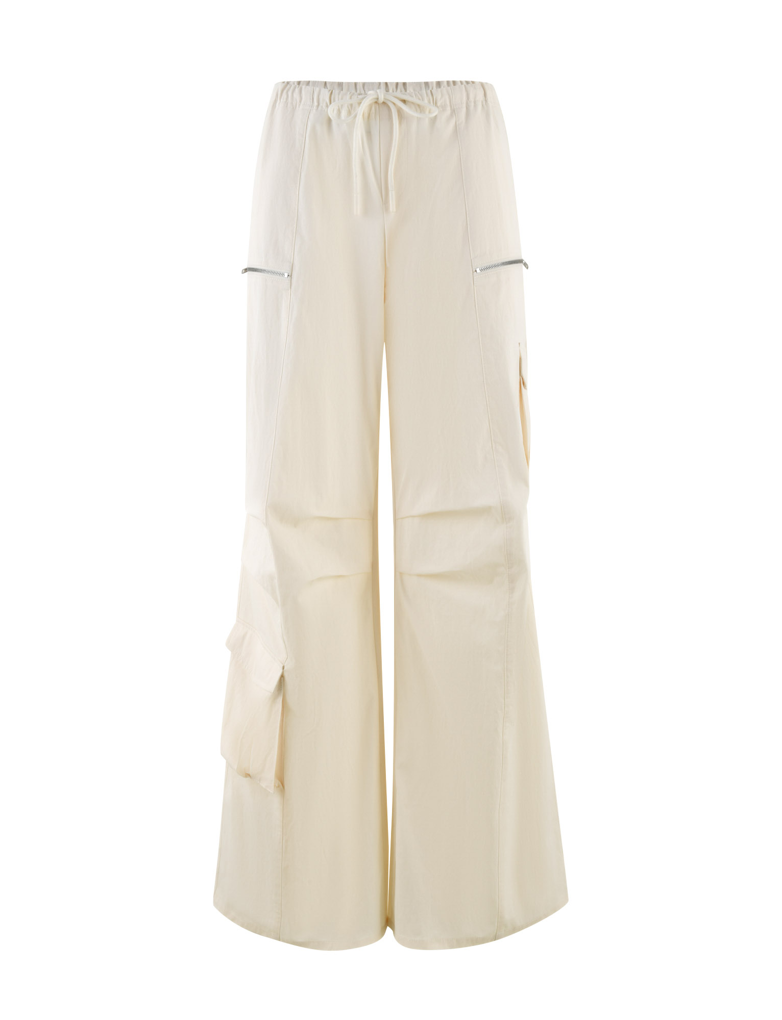 The TIGERMIST HERMIONE PANT in Soft Butter features a wide-leg cargo style with an elastic drawstring waist, zippered side pockets, and a large flap pocket, offering a loose fit for comfort and style.