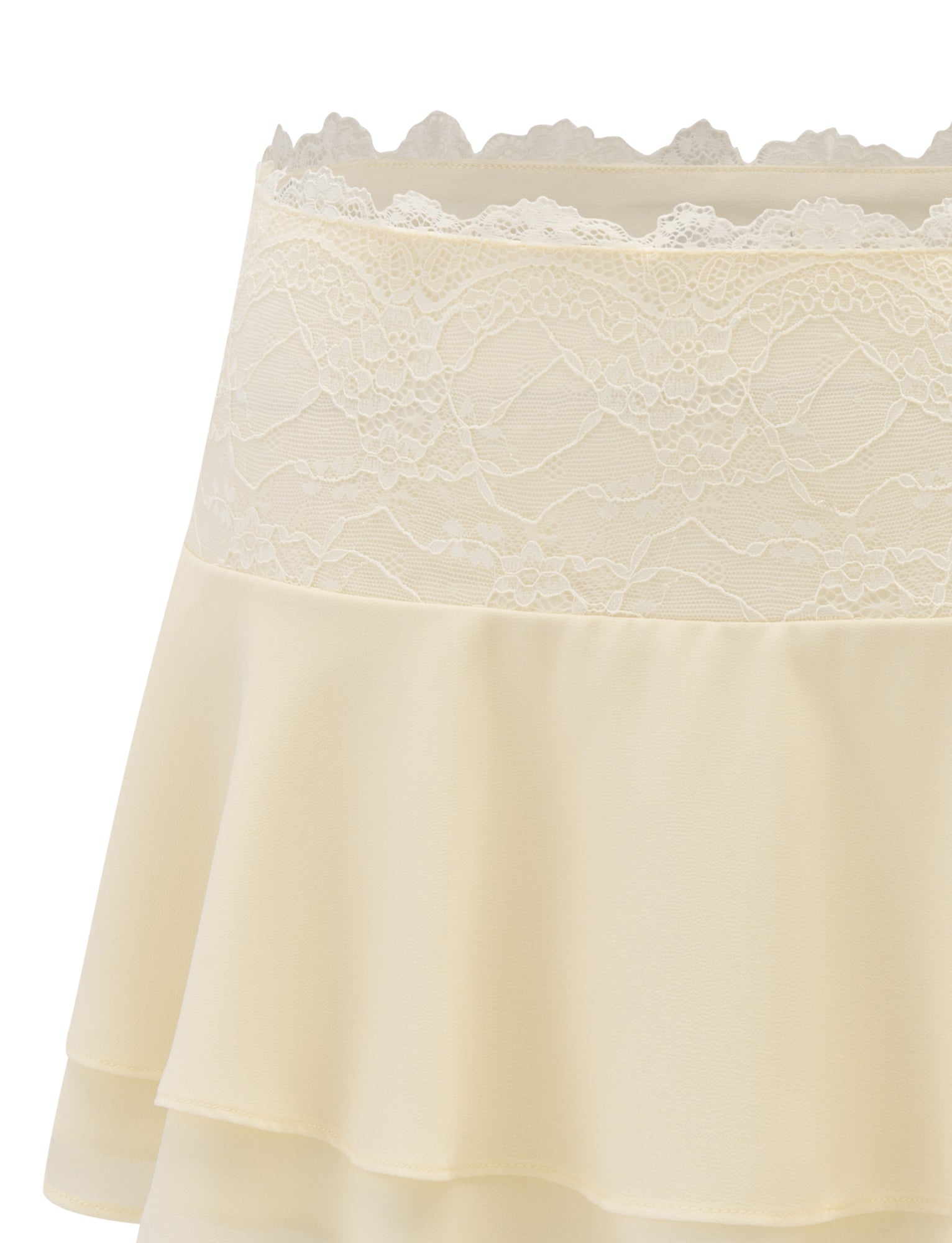 Close-up of the TIGERMIST INDIGO SKIRT in ivory, showcasing its lace waistband and tiered, flowing fabric for a soft and elegant look.