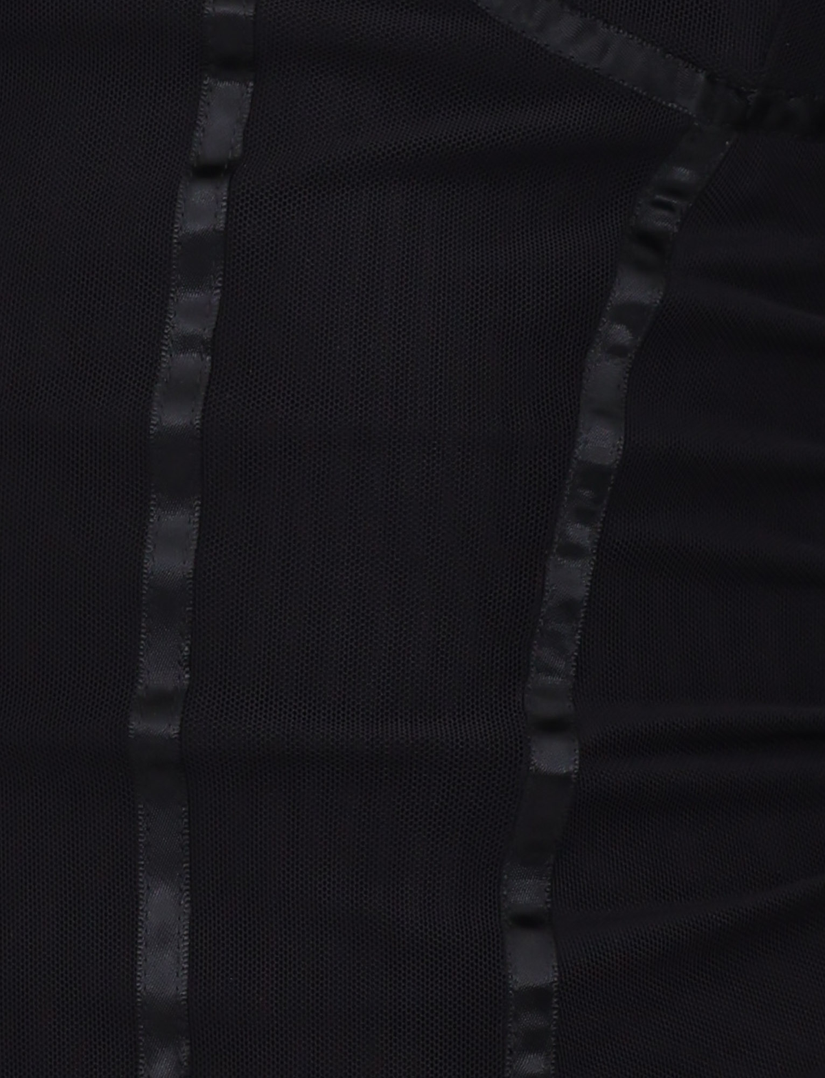 Close-up of the KAIRA CORSET TOP in black by TIGERMIST, featuring a mesh design with vertical shiny satin strips for a textured, patterned look.