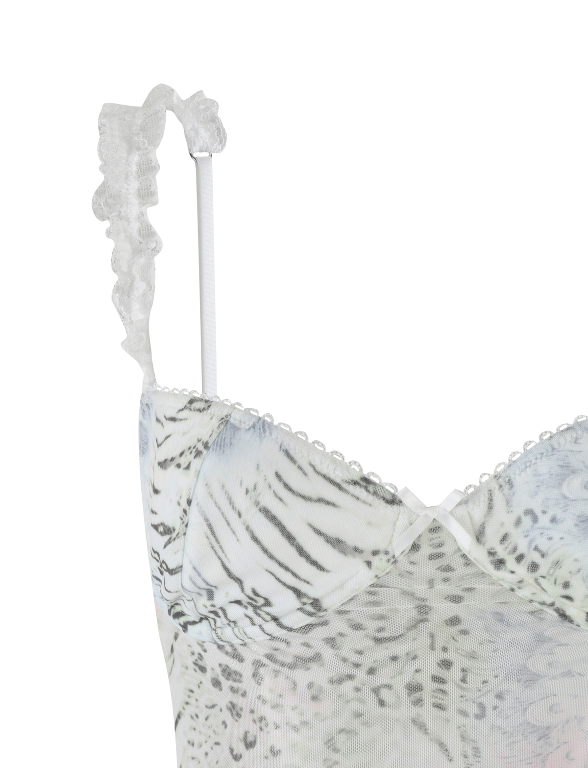 Close-up of the TIGERMIST JOSEPHINE TOP in white animal print, featuring sheer fabric, ruffled lace shoulder straps, and a small white bow at the neckline.