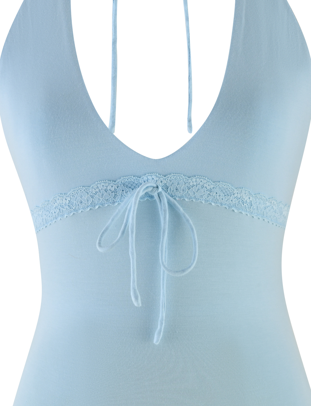 A close-up of the TIGERMIST MELLIE HALTER TOP in baby blue, featuring a deep V-neckline, lace trim under the bust, a center bow, and soft buttery jersey fabric.