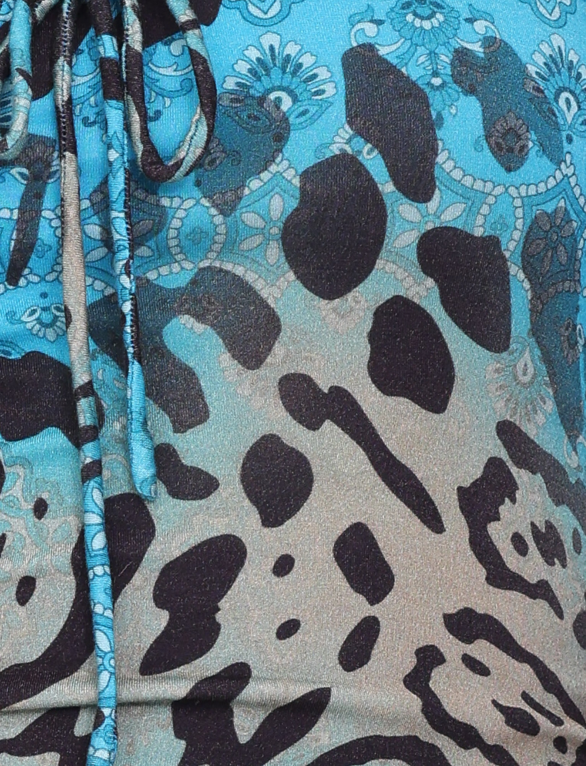 Close-up of the TIGERMIST MIRELY TOP - MULTI : LEOPARD : LEOPARD SWIRL, featuring an exclusive blue leopard and paisley print, drawstring detail on the left, and crafted from high stretch fabric.