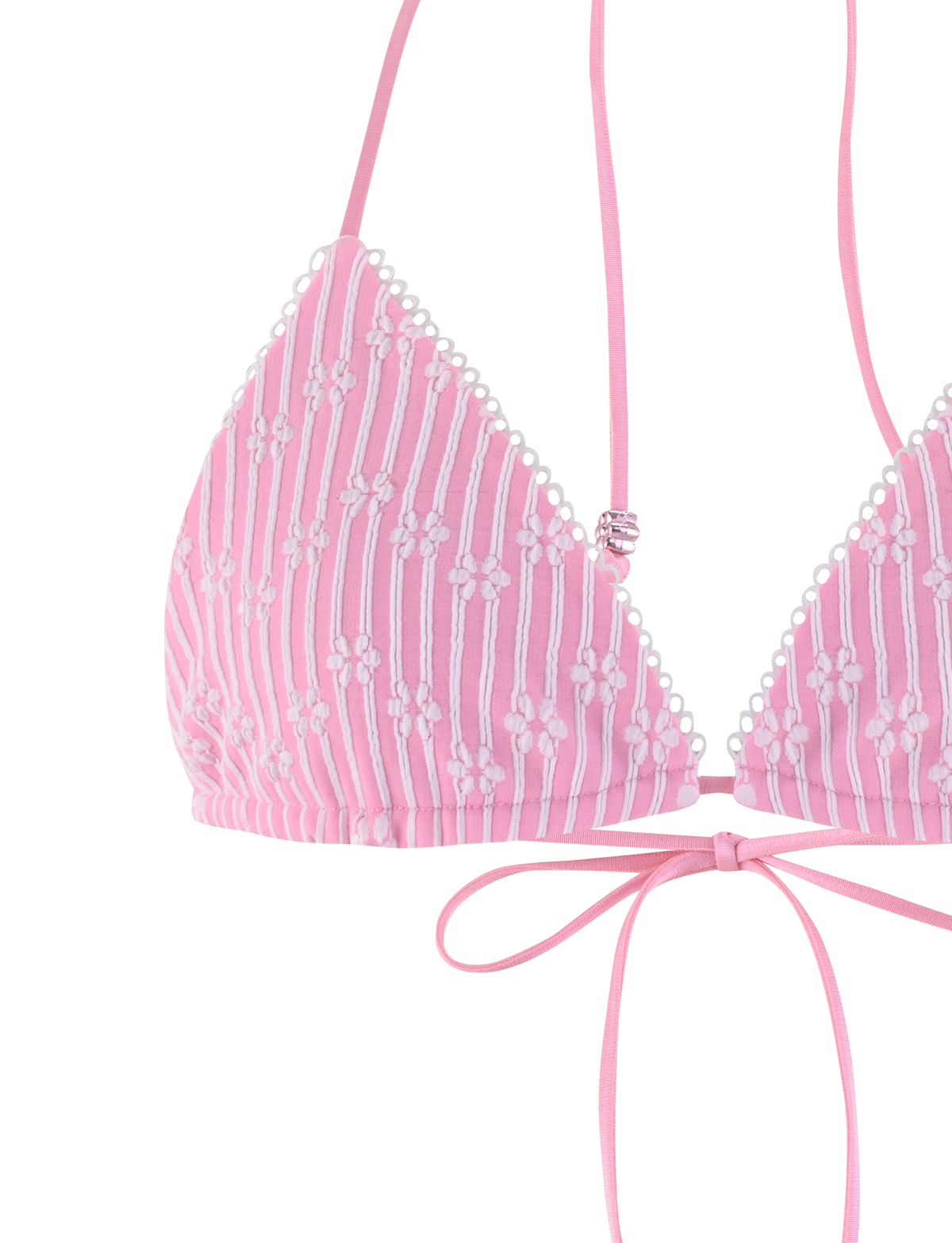 Close-up of the TIGERMIST SAHRA BIKINI TOP - PINK FLOWER STRIPE, featuring thin straps, a front bow tie, and delicate floral embroidery.