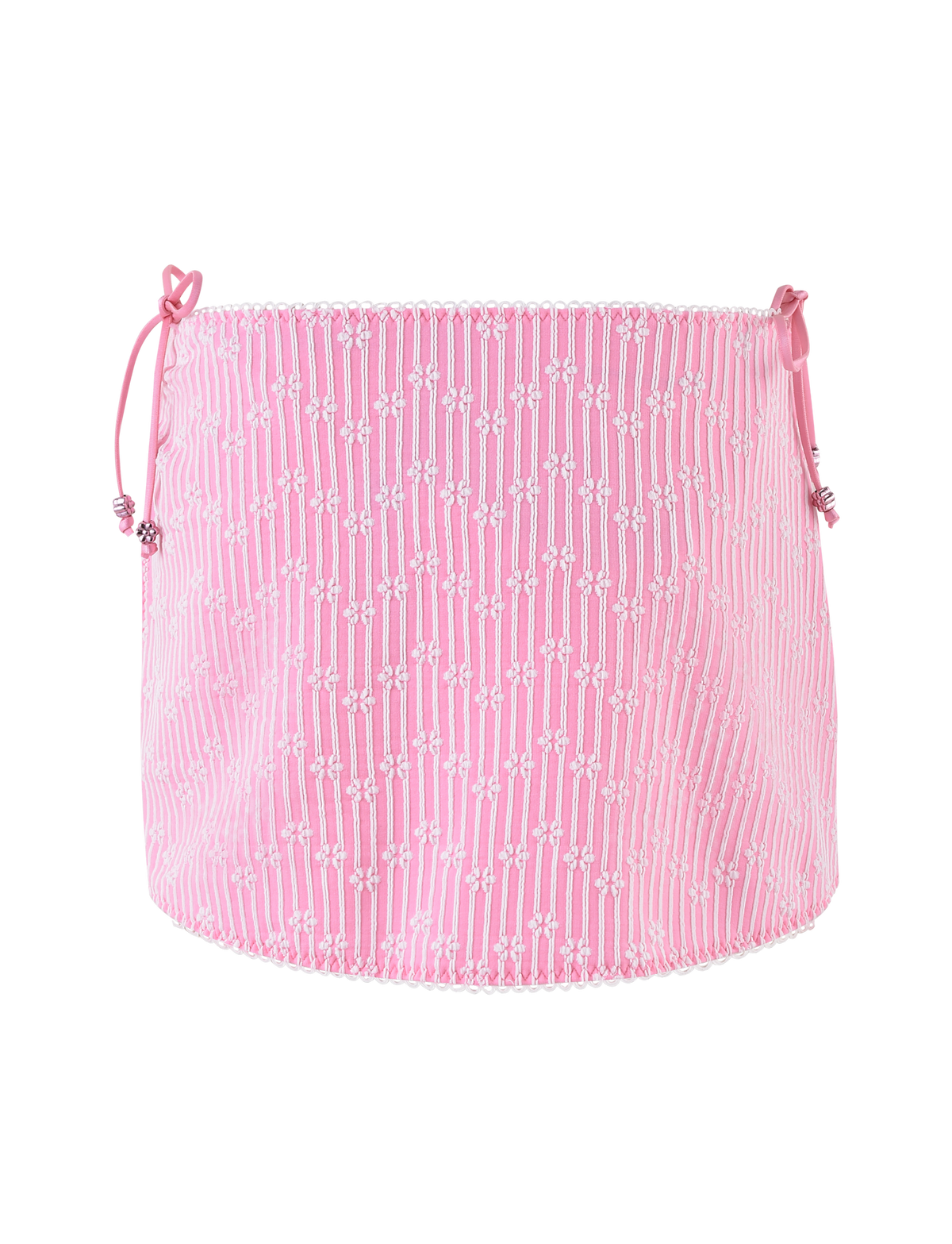 The SAHRA BIKINI 2PC BOTTOM by TIGERMIST features a pink flower stripe pattern with ribbon side ties and a slightly ruffled hem, crafted from textured rib fabric.