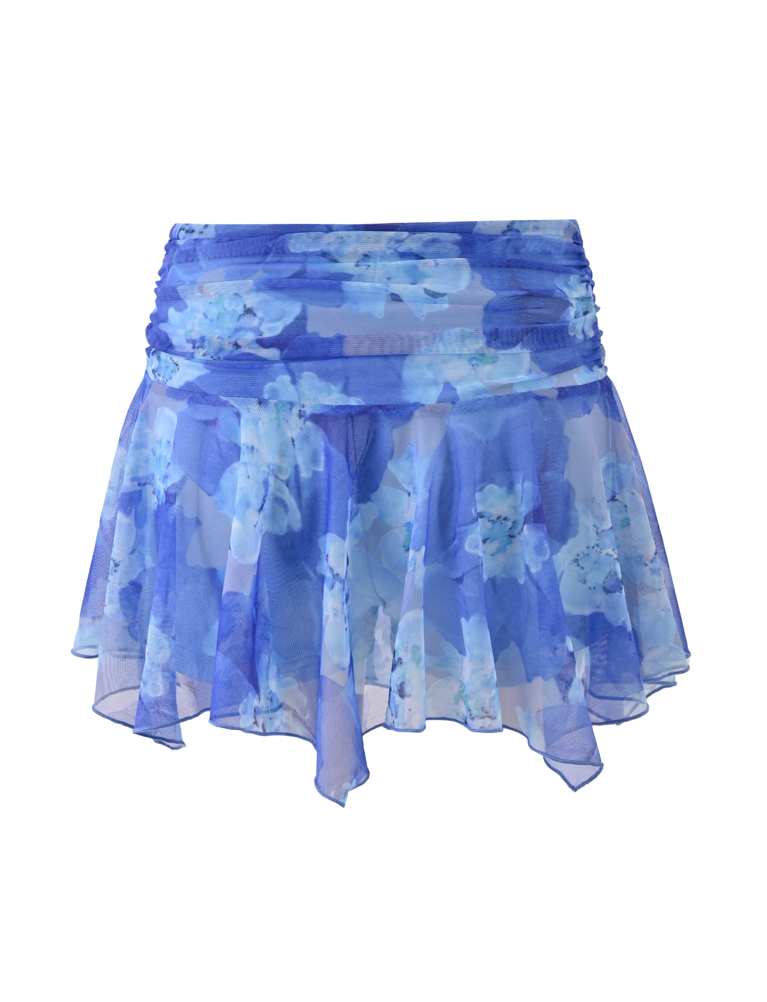 The DEVYN MINI SKORT by TIGERMIST features a blue macro floral print, sheer stretch fabric, asymmetrical handkerchief hem, and a gathered waistband.