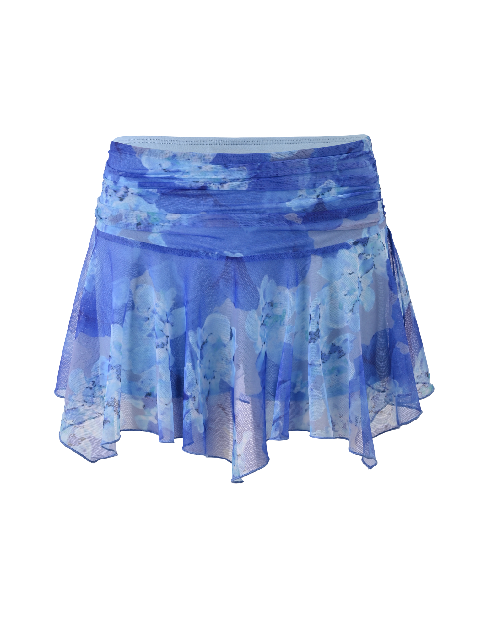 The DEVYN MINI SKORT by TIGERMIST features a blue macro floral print, asymmetric hem, and flowy, lightweight stretch fabric.