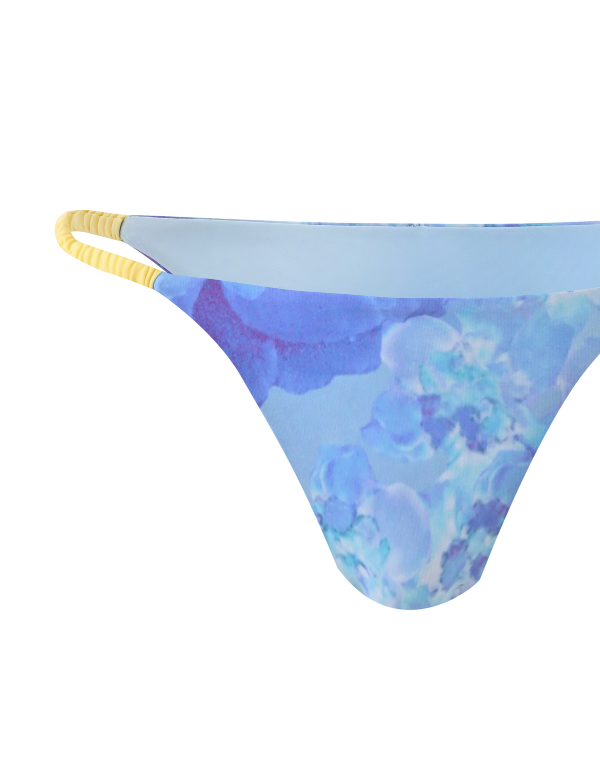 The TIGERMIST EMBERLAIN BIKINI BOTTOM - BLUE MACRO FLORAL features double yellow hip straps and a vibrant purple and blue floral print, shown on a white background.