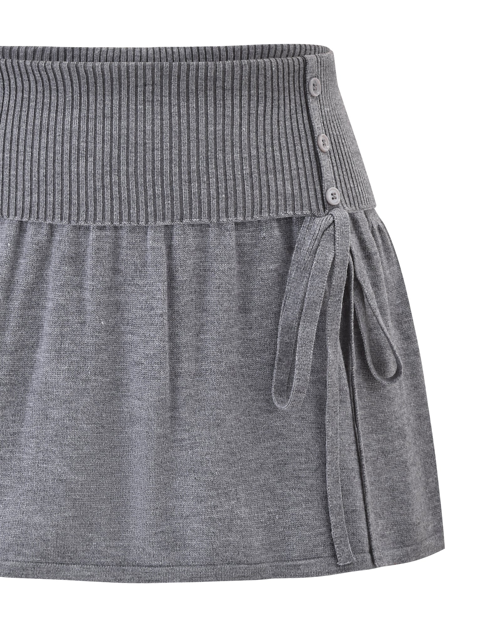 The ROWENA MINI SKIRT by TIGERMIST is a grey knit mini skirt with a wide ribbed waistband, button accents, and a side tie detail. The soft, slightly textured fabric enhances its stylish look.