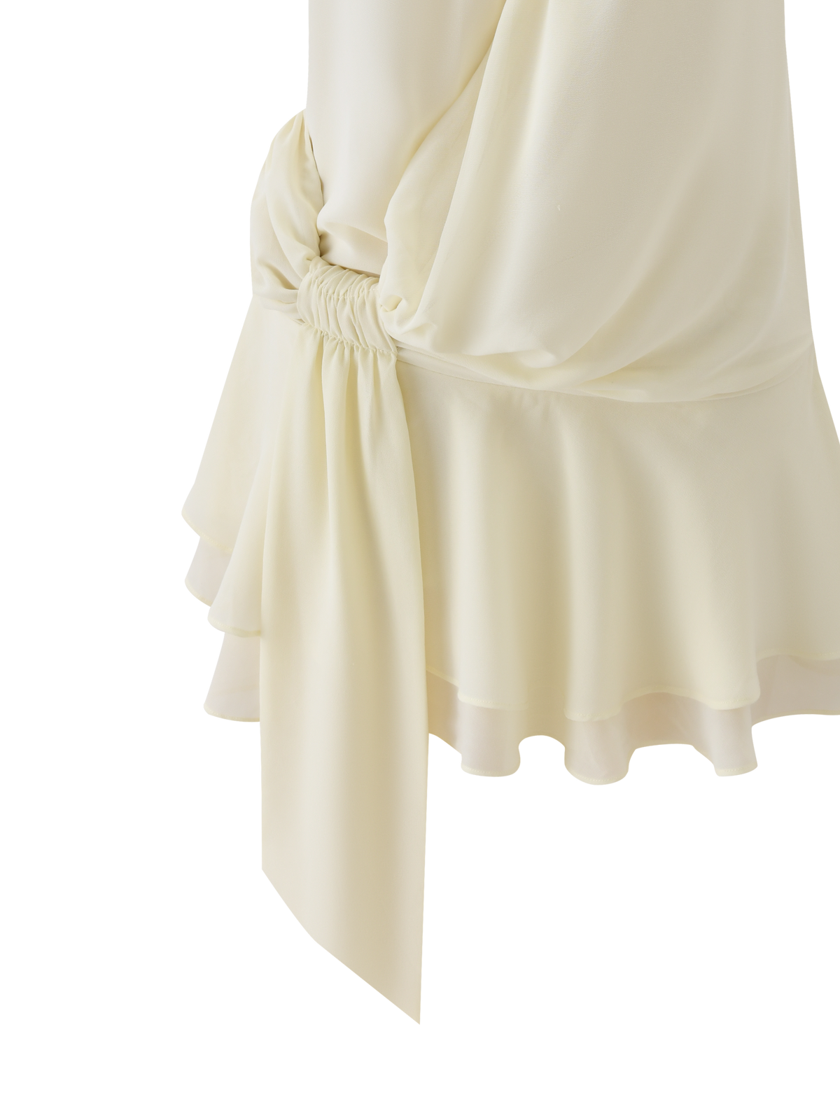 Close-up of the INDIGO MINI DRESS 2.0 - IVORY by TIGERMIST, featuring ruffled, gathered fabric and a flowing sash detail in lightweight cream material—an elegant choice for any occasion.