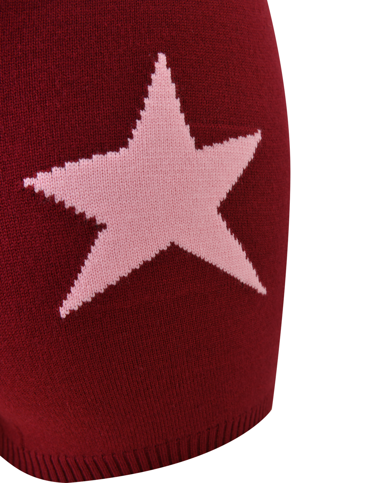 The ROUX SHORT - RED by TIGERMIST is a red knit short featuring a bold white asymmetrical star graphic at the center, crafted from soft knit fabric with visible texture and finished with ribbed edging at the hem.