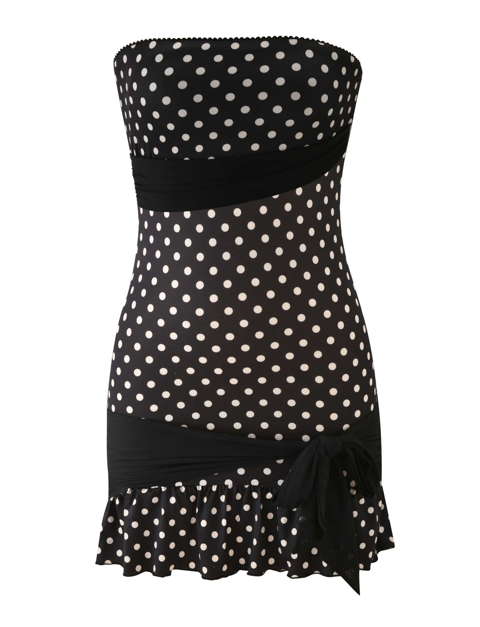 The TIGERMIST TOVE MINI DRESS in black polka dot is a strapless, bodycon mini dress featuring ruched waist and hem bands, a side bow detail, and a playful ruffle hem.