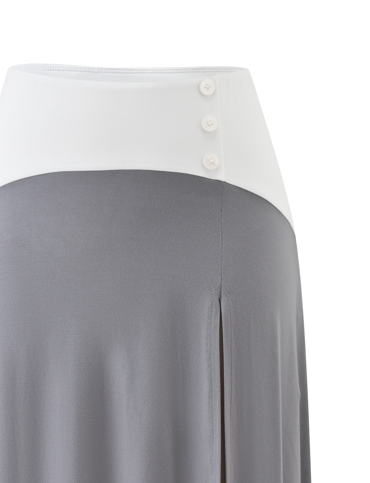 The ALYSSA HI LO SKIRT by TIGERMIST features a high waist, wide white waistband with three buttons, flowing grey fabric, asymmetrical hem, and a chic front leg slit.