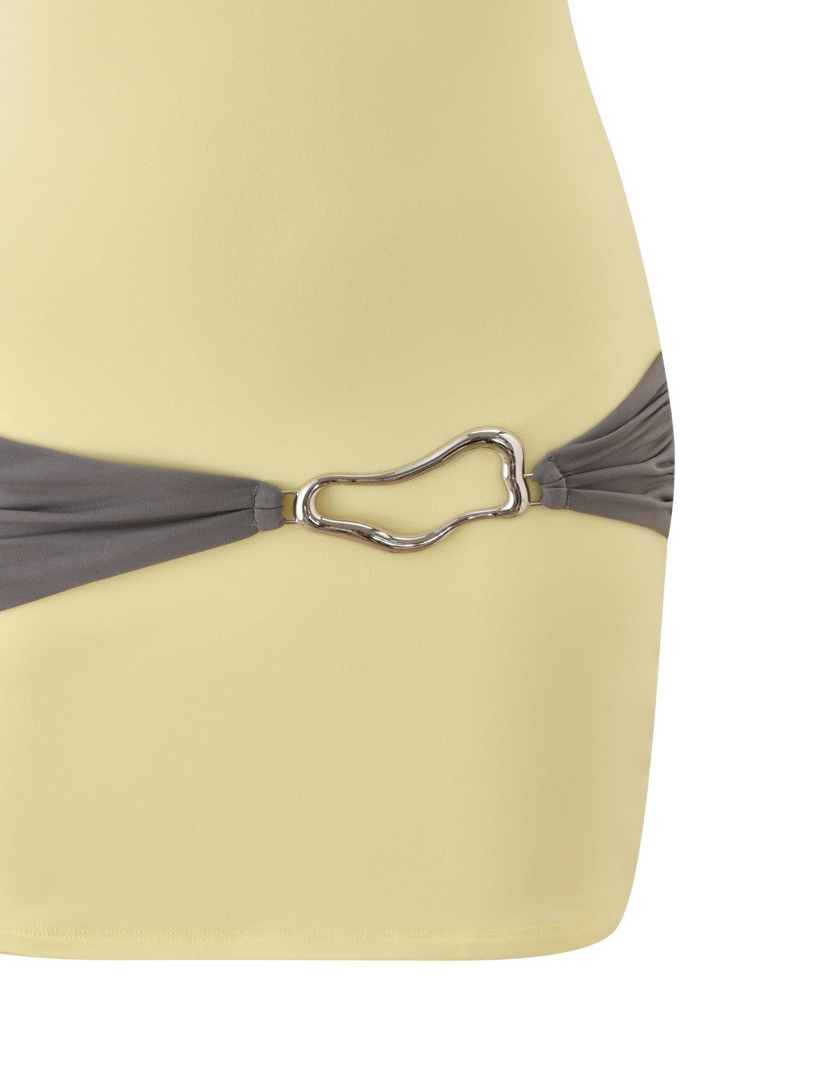 A close-up of the TIGERMIST EOS MINI DRESS in butter yellow and grey, showcasing a gathered waist with a grey band and a silver abstract-shaped metallic buckle.