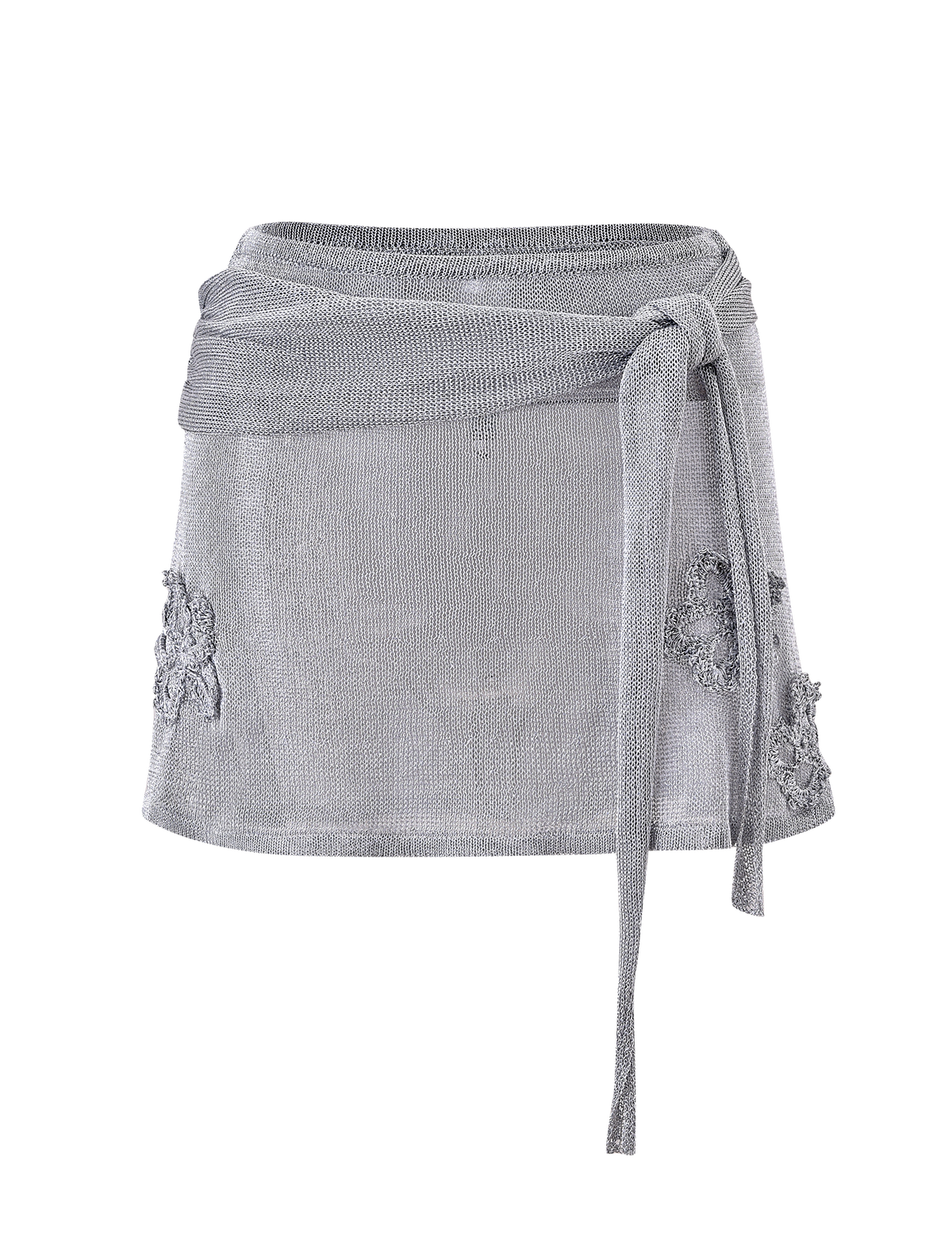 The TIGERMIST ISATANA MINI SKIRT - SILVER features a light gray metallic knit, wrap-around design, long right-side tie belt, and lace embroidery on both hips, shown against a plain white background.