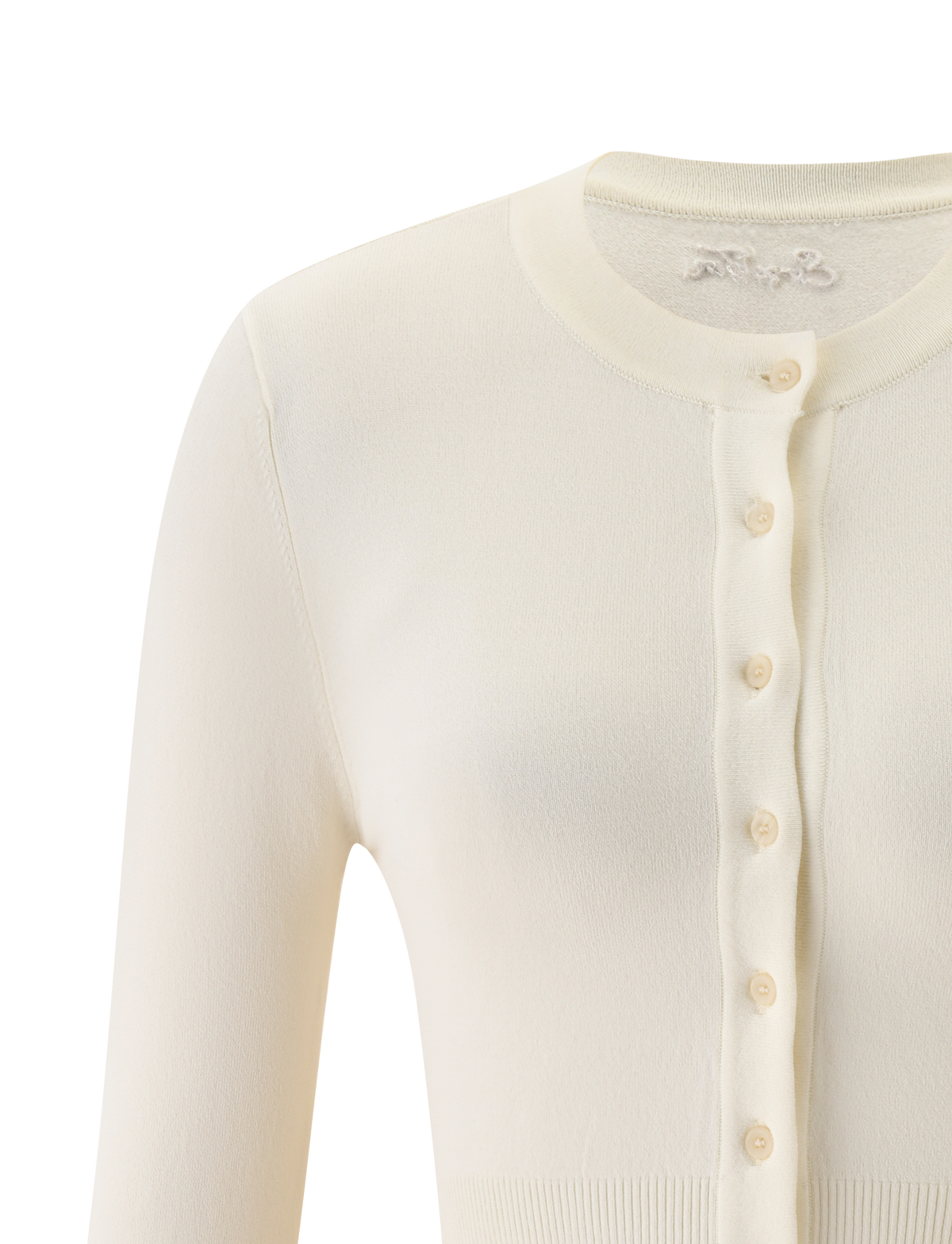Close-up of the TIGERMIST DAMARIS CARDIGAN in cream, a knit button-up with a round neckline, ribbed hems and cuffs. The cropped silhouette’s upper half is visible, showcasing its soft, cozy fabric.