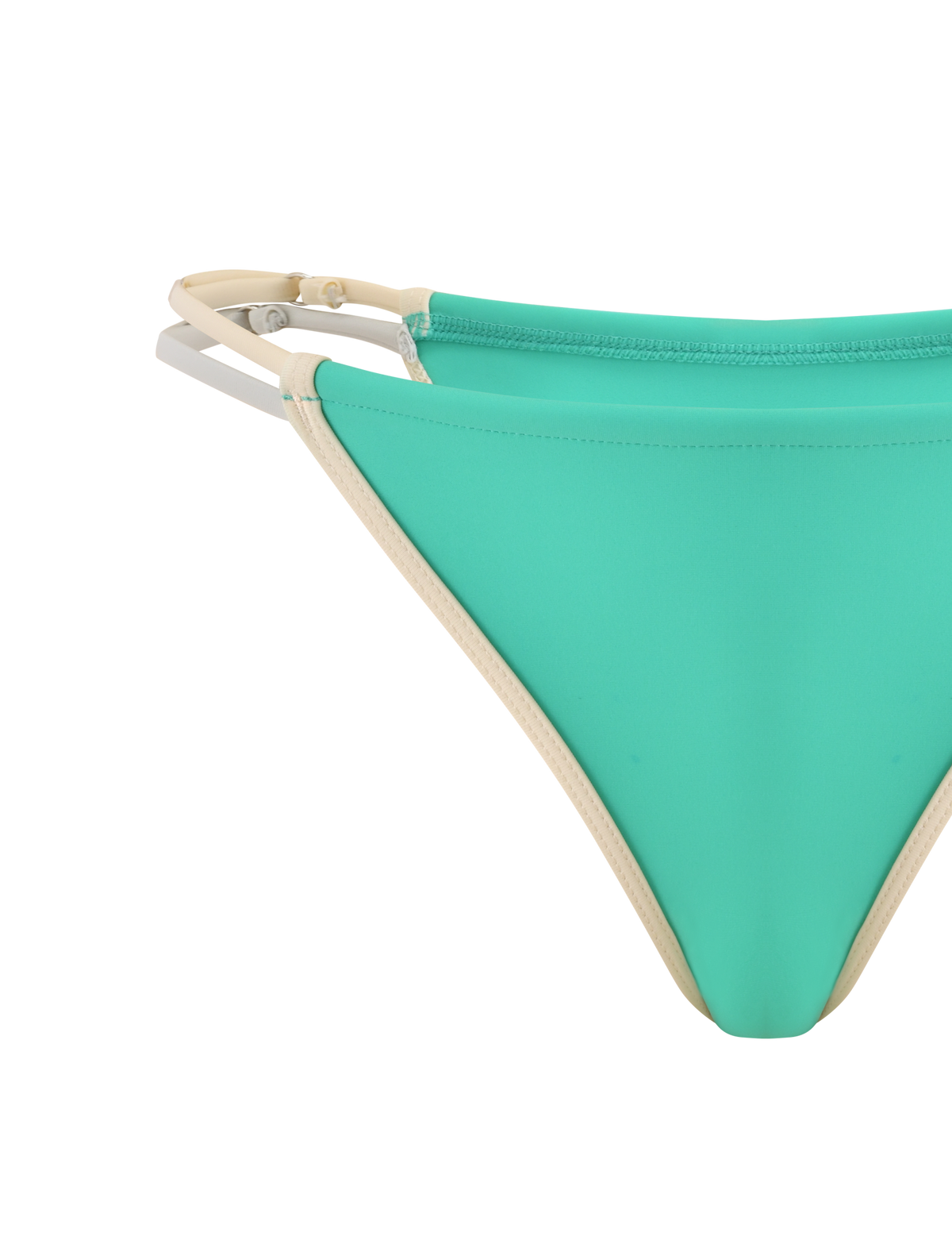 A close-up of the TIGERMIST JACE BIKINI BOTTOM in Kelly Green, featuring beige trim and adjustable straps, displayed against a white background.
