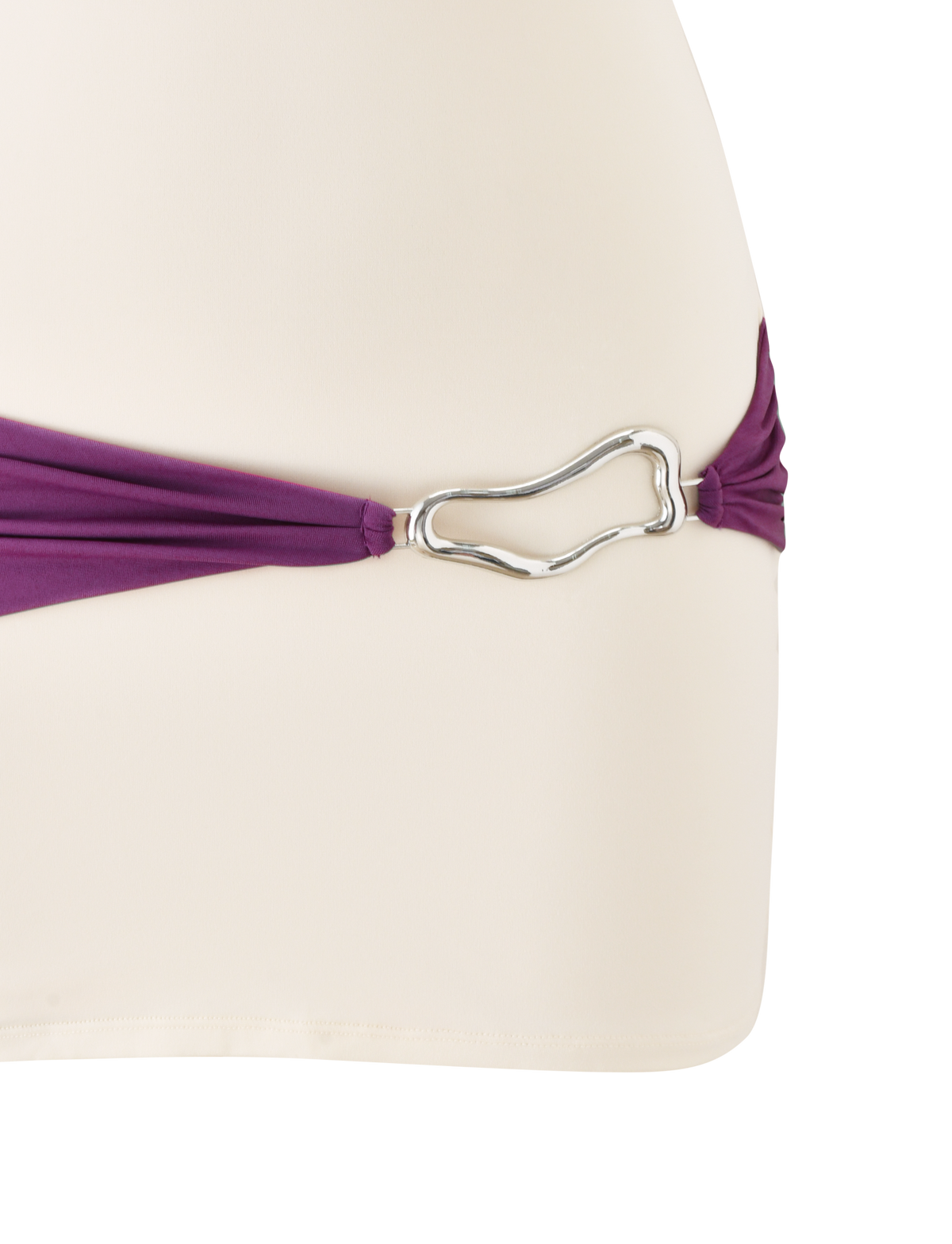 A close-up of the TIGERMIST EOS MINI DRESS in cream and dusty lilac, featuring a color-blocked design with a purple strap and a silver, irregular-shaped metal buckle on one side.