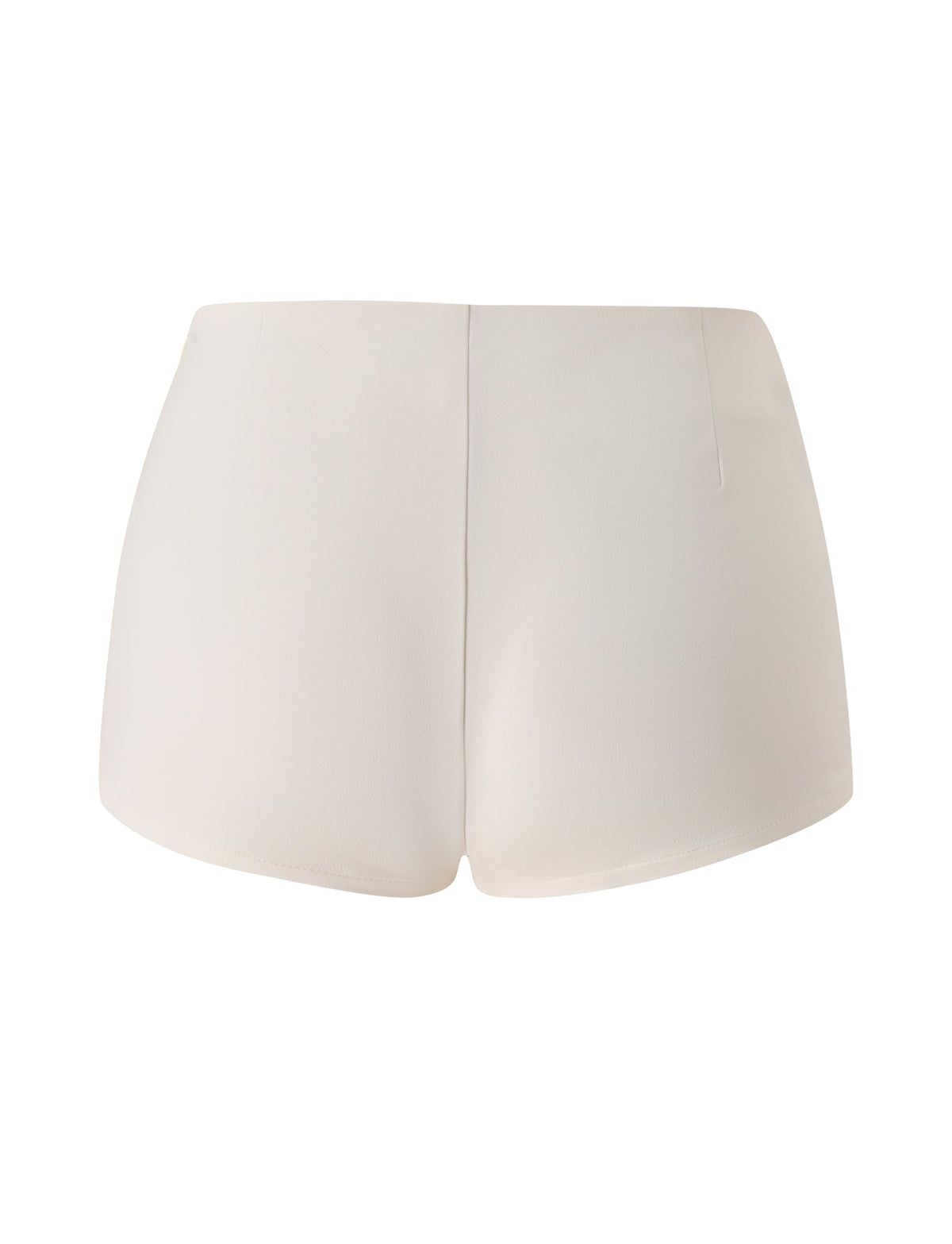 Back view of the TIGERMIST KITTIE BUCKLE SHORT in cream—a pair of high-waisted mini shorts made from stretch suiting fabric, showcasing a smooth texture and clean, minimal design with no visible pockets or embellishments.