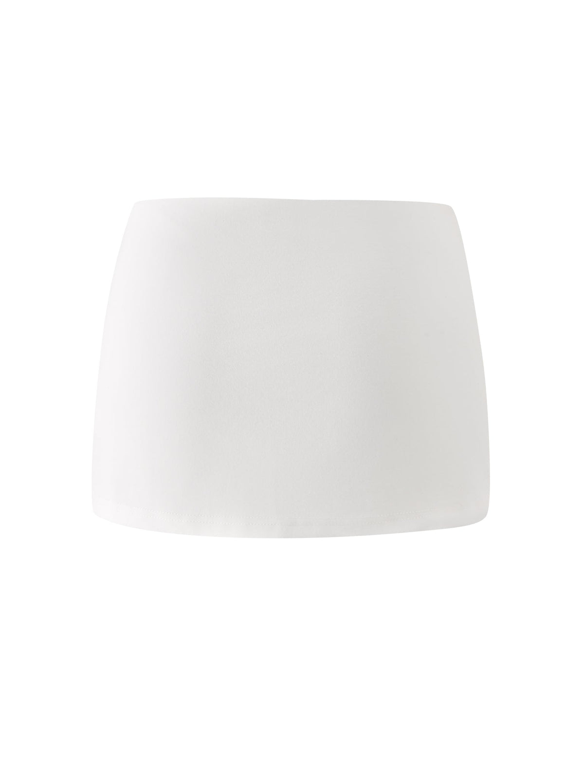 The VICTORIA MINI SKORT - IVORY by TIGERMIST, featuring a low rise and bodycon fit, is displayed against a white background.