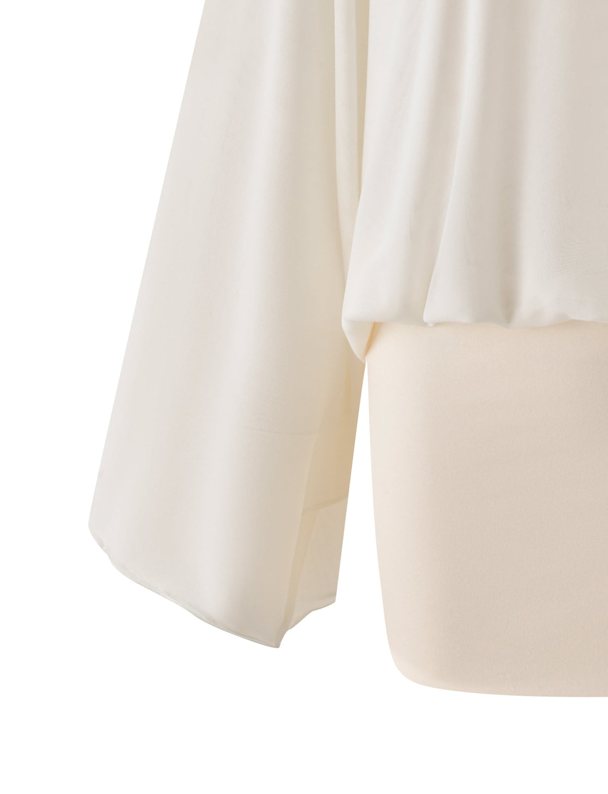 Close-up of the TIGERMIST CAMILLE MINI DRESS - CREAM, highlighting its long wide sleeve, loose draped layer over a fitted skirt, and soft, smooth fabric.