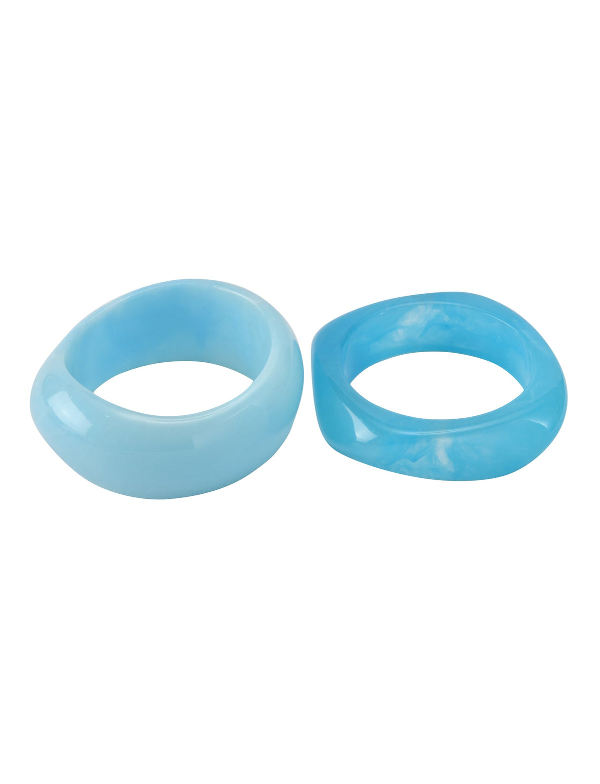 The MIKAH BANGLE SET - AQUA by TIGERMIST features two chunky, smooth resin bangles in organic shapes and varying shades of blue, displayed together on a white background.