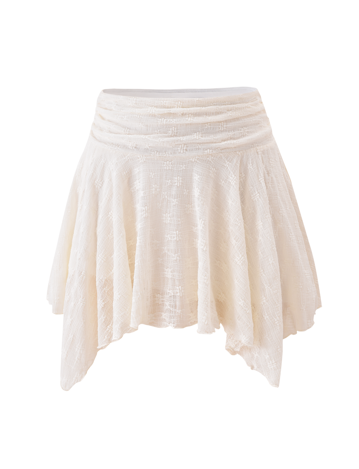The TIGERMIST MYLAH MINI SKIRT in ivory showcases eyelet lace, a textured A-line silhouette, an asymmetrical handkerchief hem, and a gathered waistband, set against a plain white background.