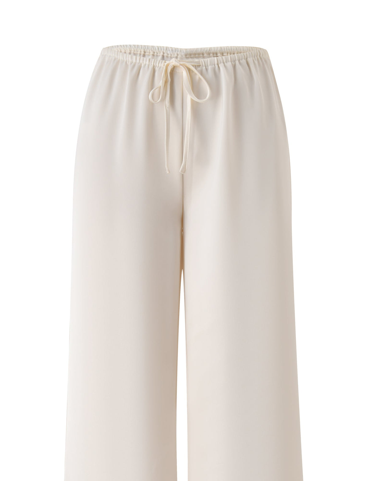 The MAURA PANT - WHITE by TIGERMIST showcases wide-leg cream pants made from drapey satin fabric, designed with an adjustable drawstring and elastic waistband, displayed against a plain white background.