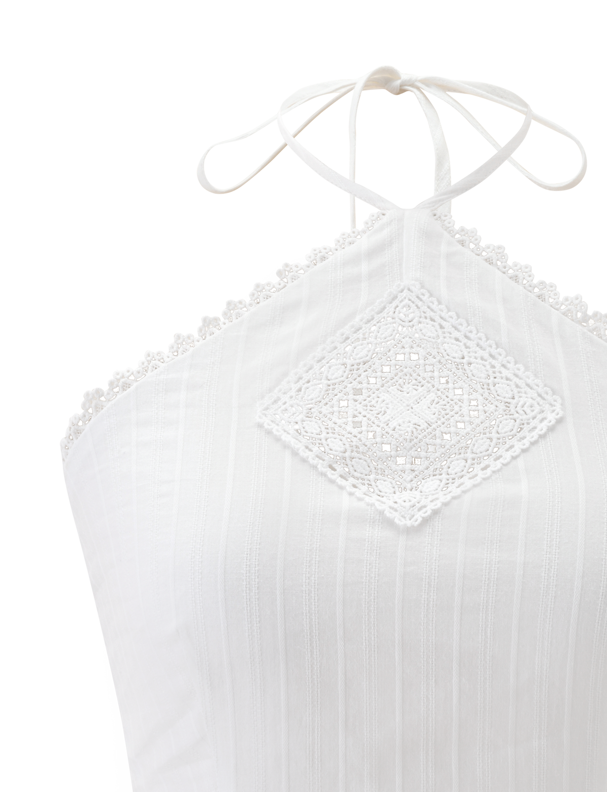 A close-up of the TIGERMIST LILETH TOP in white, showcasing a halter neck with a lace diamond pattern center and scallop eyelet trims on the neckline. The textured woven fabric has subtle vertical stripes.