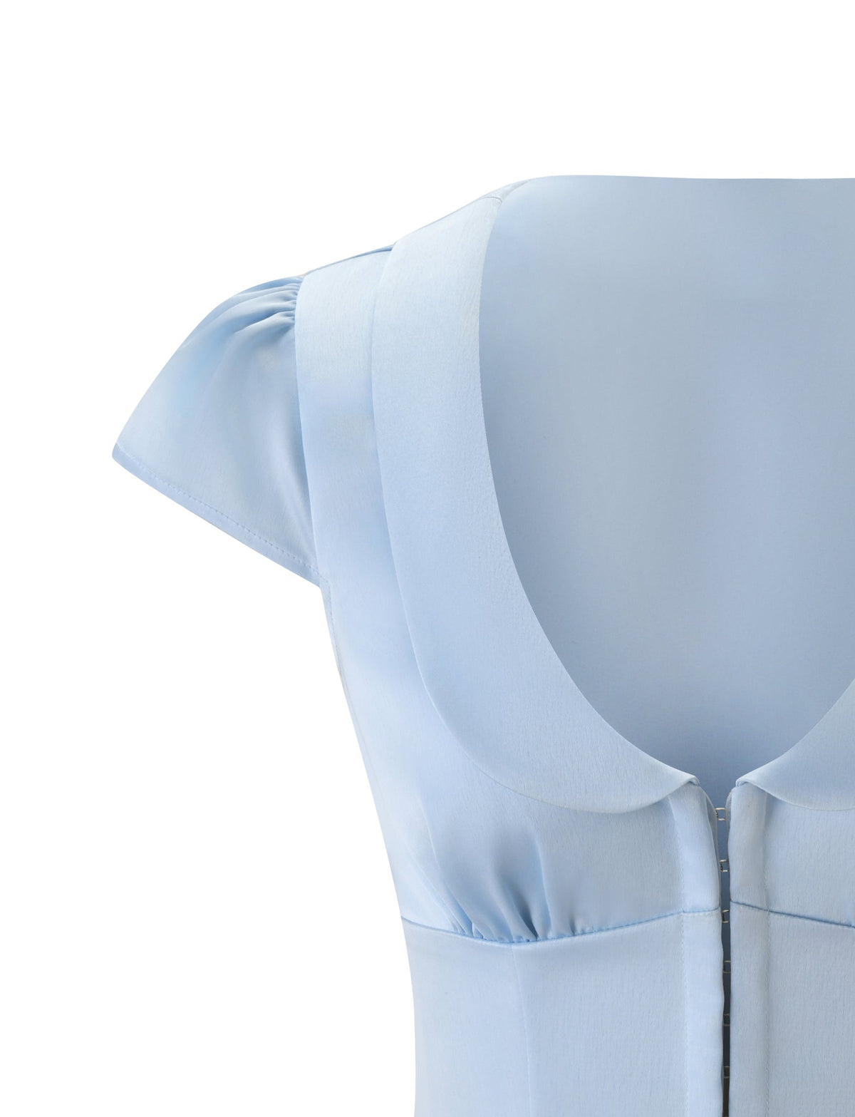 Close-up of the MAURA TOP - SKY by TIGERMIST, featuring cap sleeves, a scoop neckline, and princess seams in a smooth, slightly shiny sky blue fabric.