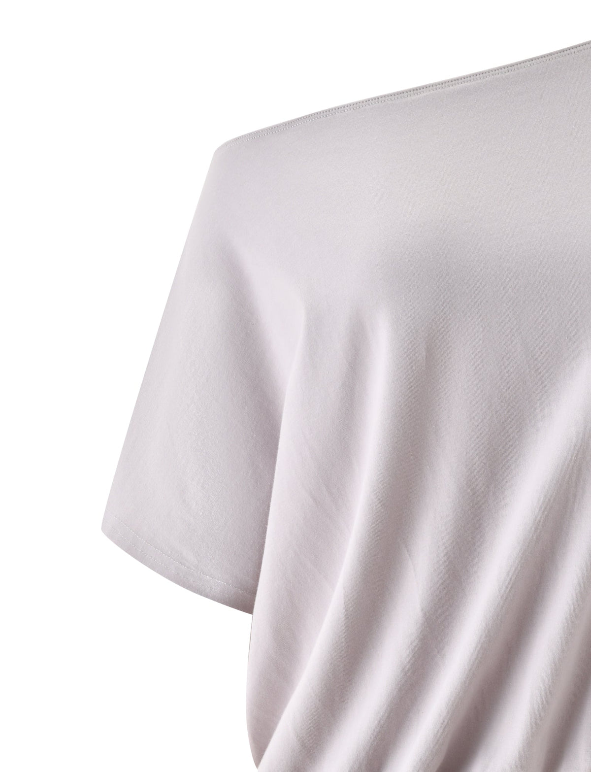 A close-up of the DRELLA TOP in Dove Grey by TIGERMIST, highlighting the shoulder and short sleeve area. The fabric appears soft with subtle natural wrinkles, creating a gentle blouson silhouette.