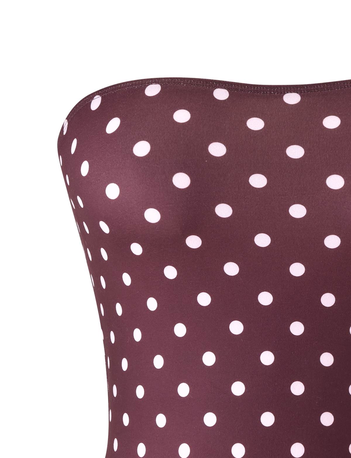 Close-up of the VALI POLKA DOT TOP by TIGERMIST in chocolate with pink dots, featuring a strapless fit secured by discreet gel tape for confidence, shown against a plain light background.