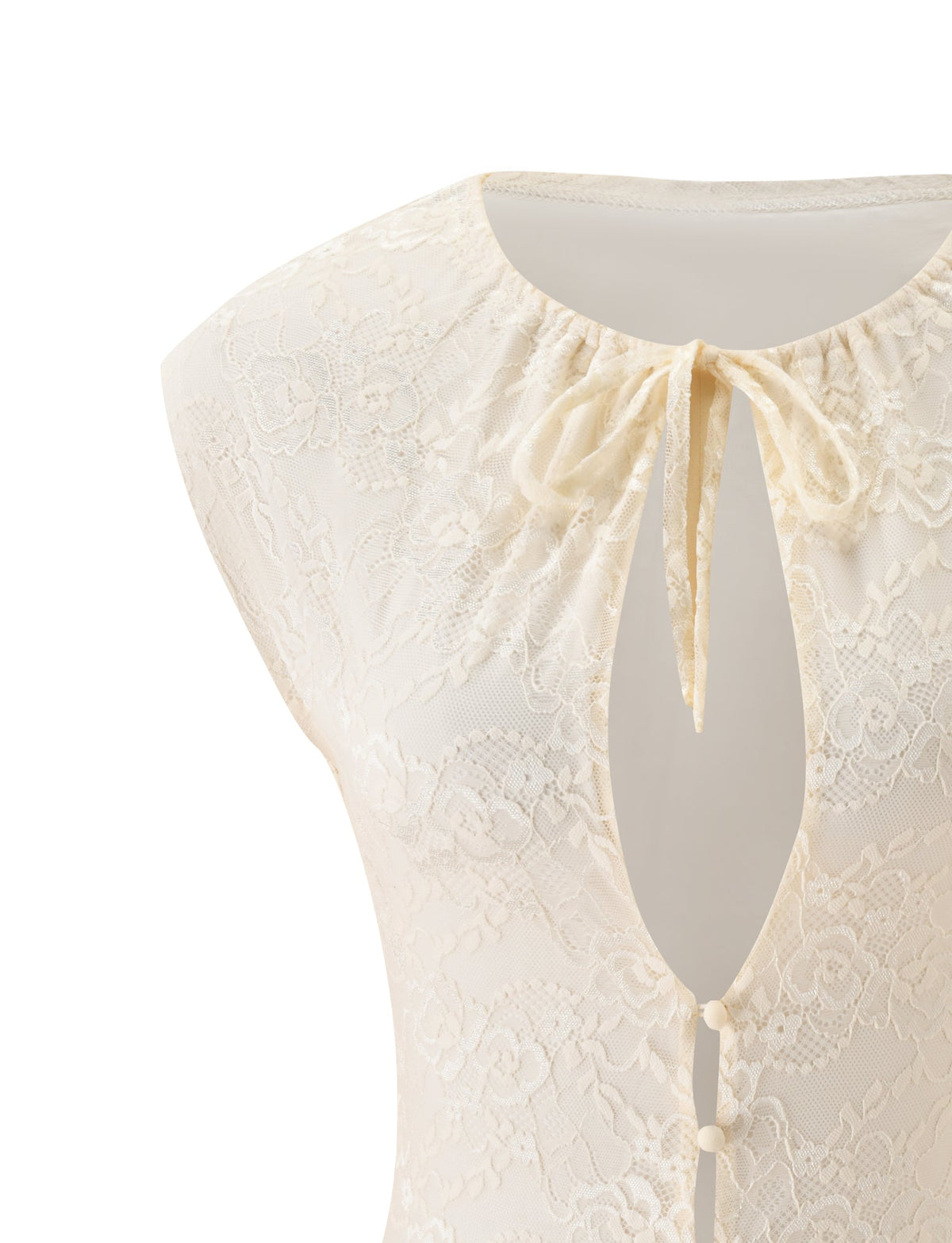 The TONYA TOP - CREAM by TIGERMIST is an ivory lace garment featuring a keyhole neckline, short cap sleeves, a ribbon tie at the collar, and fabric-covered buttons down the front. This cream lace top showcases a delicate floral pattern for an effortlessly elegant touch.