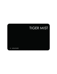 A black rectangular digital card with rounded corners showcases "TIGER MIST USA" in bold white letters at the top right and "E-VOUCHER" at the bottom left. It effortlessly integrates into your Apple Wallet for easy access, all set against a sleek, plain white background.