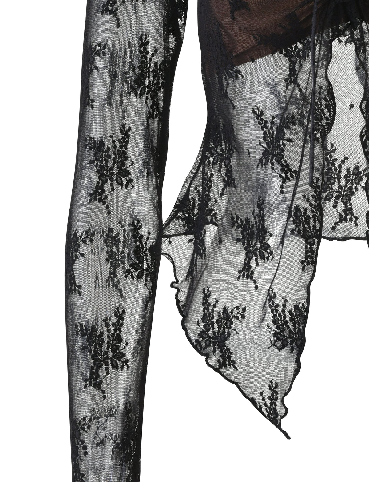 Close-up of a lace sleeve in the Karolina Long Sleeve Top - Black by Tigermist, showcasing intricate floral patterns. The sheer fabric of this design reveals delicate details and a scalloped edge, hinting at an elegant and sophisticated garment.