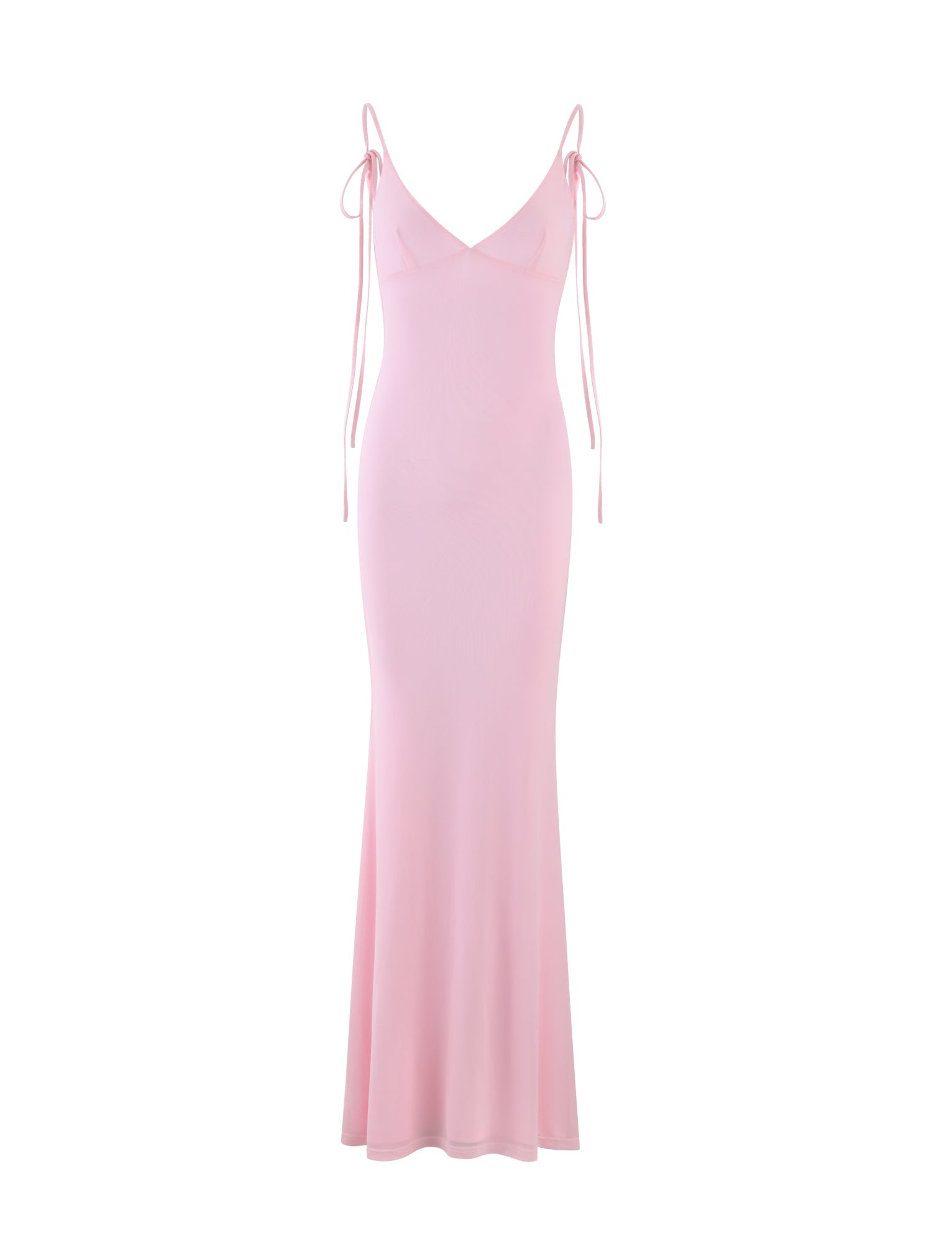 The KYLAH DRESS - PINK : BABY PINK by TIGERMIST is a long, pale pink dress featuring spaghetti straps with decorative ties at the shoulders. The dress is form-fitting at the top and gently flares out toward the hem, creating an elegant, flowing silhouette.