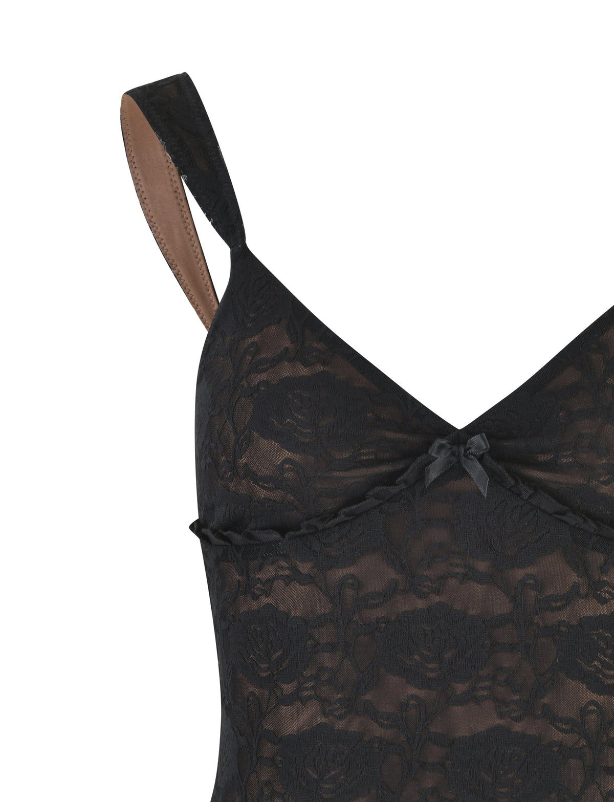 Close-up of the ISADORA TOP - BLACK : LACE by TIGERMIST, showcasing its thin shoulder straps and intricate floral lace pattern. A small ribbon bow accents just below the V-neckline, and the inside of the straps is lined with a nude material.